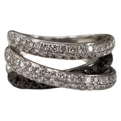 14k white gold diamond "cross over" ring with white and black diamonds