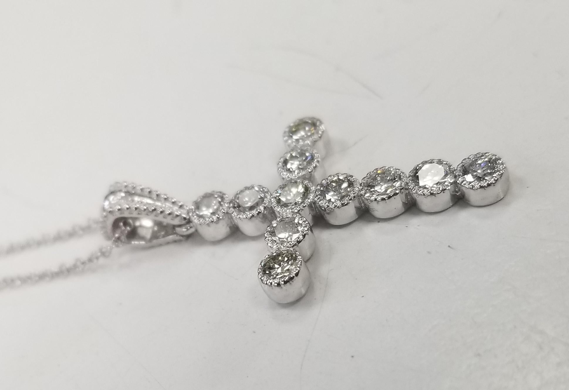 Spécifications :  
    Longueur de la CHAÎNE : 16 pouces
    Poids de la CHAÎNE et du PENDANT : 4,4 grammes
    PIERRES :   11 DIAMANTS DE 0,90 CARATS
    COULEUR ET CLARTÉ :     F-G VS2-SI1   
    métal:14k OR BLANC
    type:CHAÎNE  & PENDANT
   
