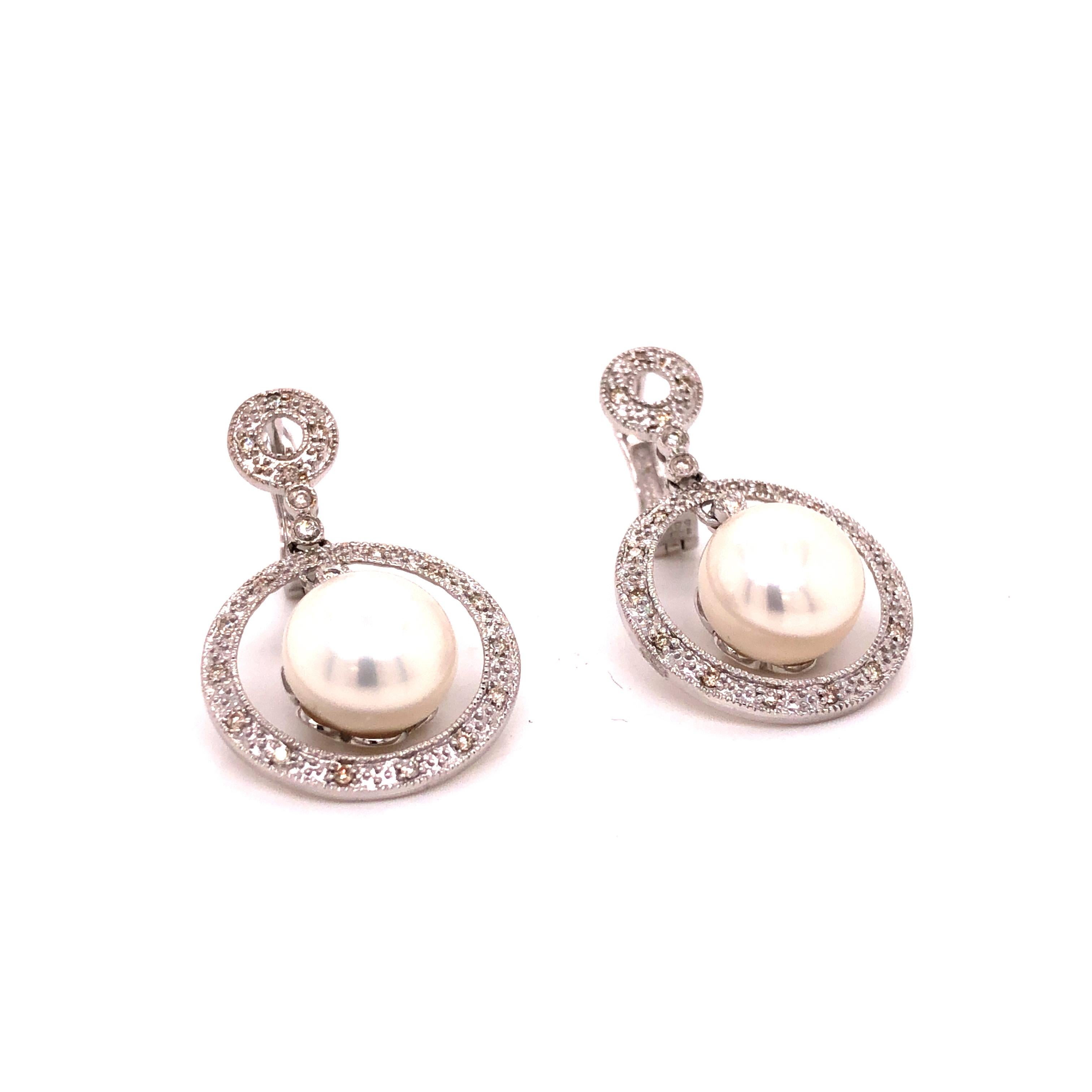A pair of 14K White Gold Diamond Cultured Pearl Earrings. Diamond weight ~ .28 carat