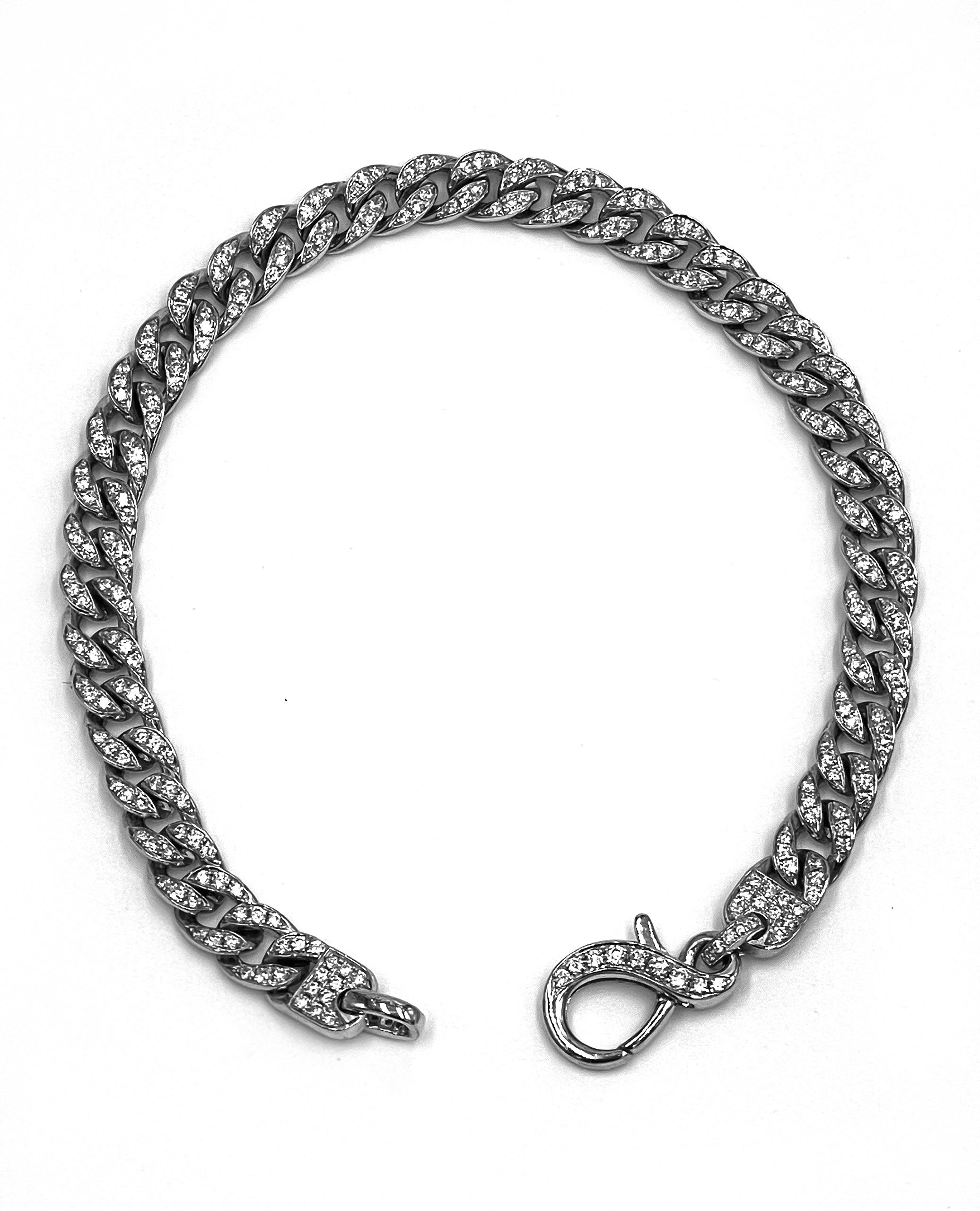 14K white gold diamond curb bracelet with diamond accented lobster clasp.  The bracelet is pave set with round brilliant-cut diamonds 1.58 carats total weight. 

- 7.25 inches long.
- Diamonds are G/H color, SI1/SI2 clarity.