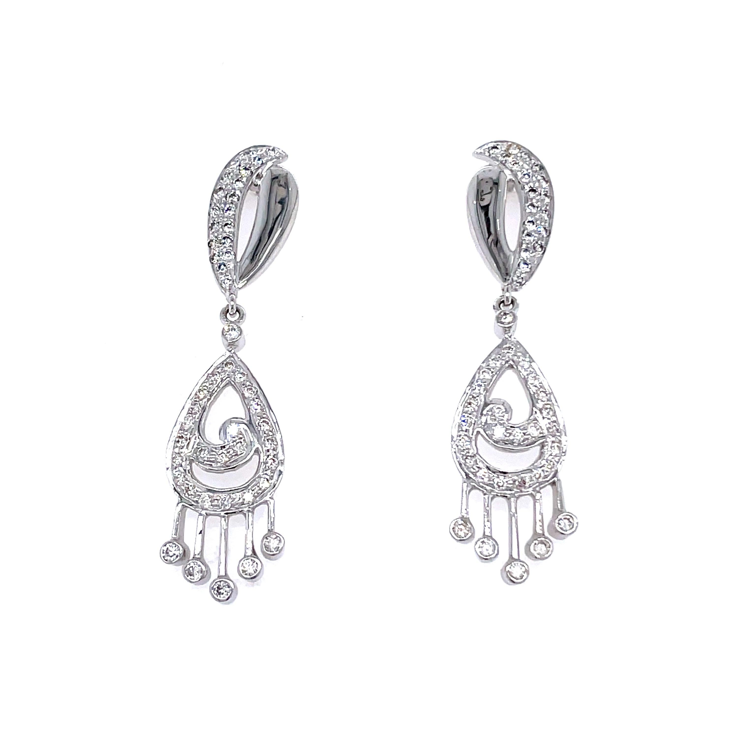 14K White Gold Diamond Dangling Earrings 1.09 Cts

This pair of 14K white gold diamond dangling earrings is unquestionably a symphony of sophistication and glitz. 

These chandelier earrings boast an ensemble of round brilliant pavé diamonds,