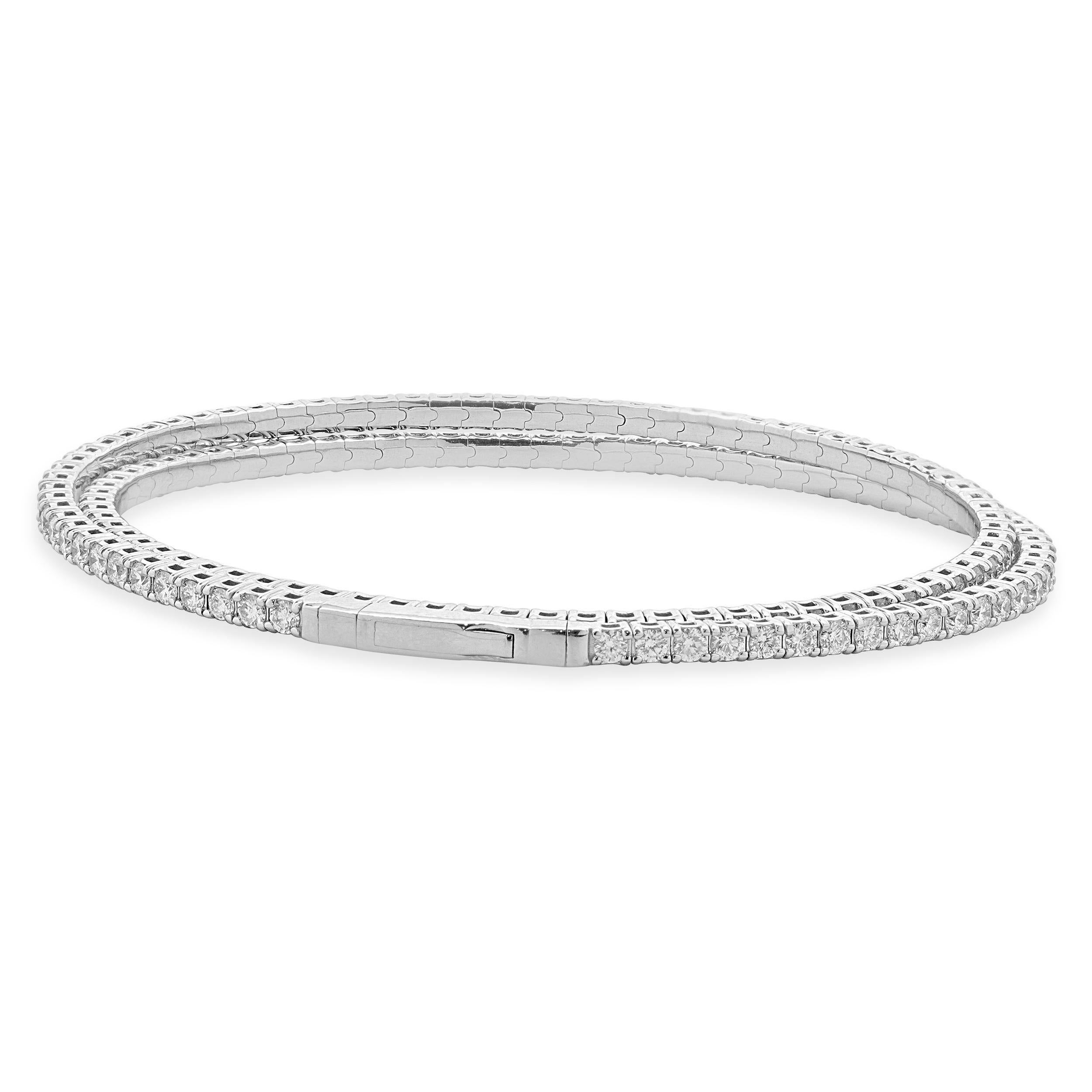 Designer: custom design
Material: 14k white Gold
Diamond: round brilliant cut= 5.30cttw
Color: G
Clarity: VS-SI1
Dimensions: bracelet will fit up to a 7-inch wrist
Weight: 15.70 grams
