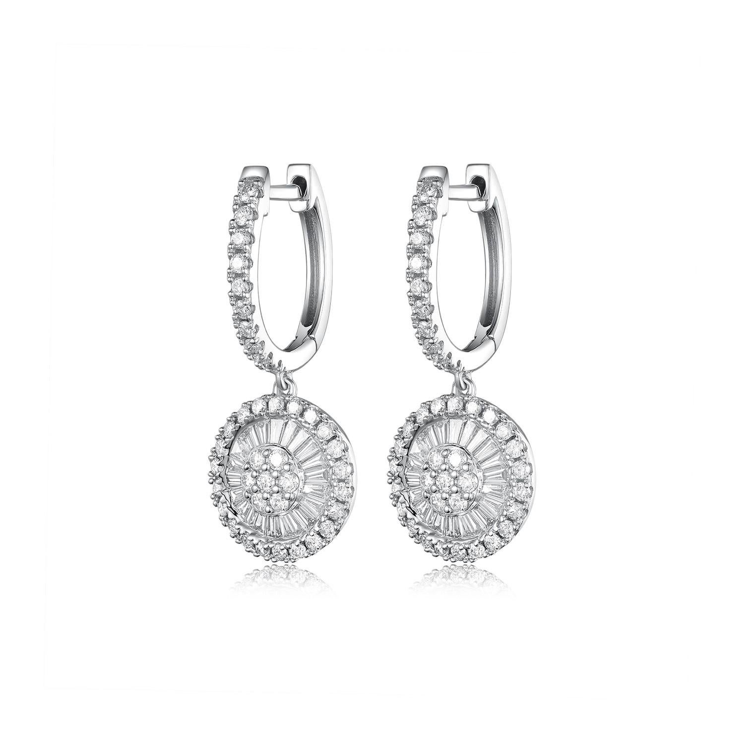 
These stunning drop earrings are a masterpiece of design, featuring 0.87 carats of diamonds set in 14 karat white gold. The earrings showcase a dazzling array of round brilliant-cut diamonds arranged in a captivating circular pattern. The central