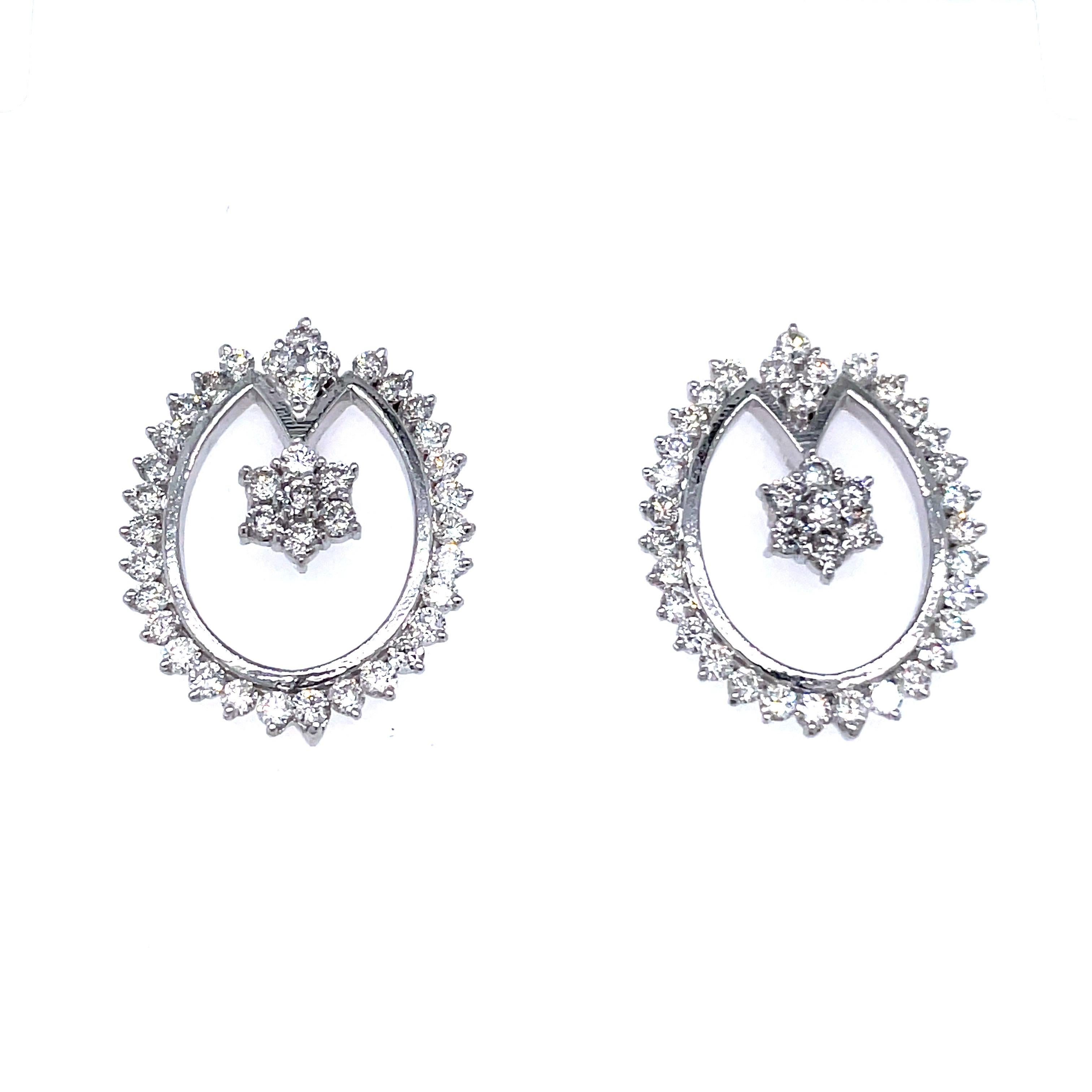 14k White Gold Diamond Earrings With Tulip Pattern

Glistening diamonds, totaling 1.79 carats, grace these earrings with their brilliant radiance. 

Fashioned from 14k white gold, these earrings weigh 4.98 grams, offering a blend of luxurious