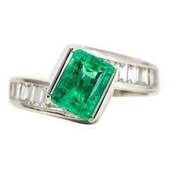 14 Karat White Gold Diamond Emerald Bypass Ring