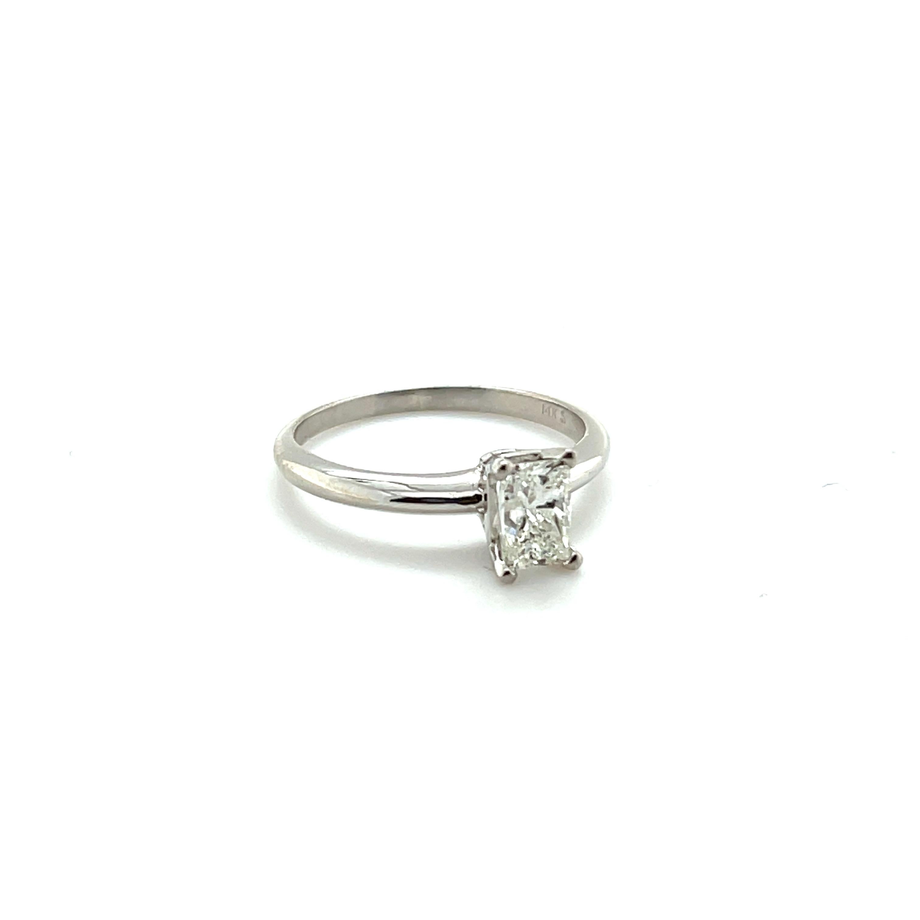 Gender: Ladies
Size: 6.5 US
Total Weight: 2.33 grams
Purity: 14K White Gold
Shank type: Half Round
Condition: Pre-owned in excellent condition. Quality and Durability was checked by professional jewelers.

4-Prong Set in 14 Karat White Gold