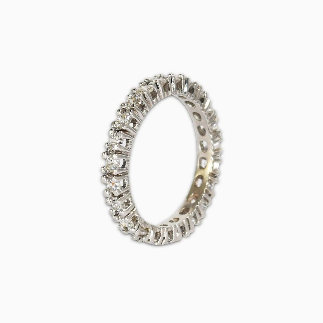 14k white gold diamond eternity ring.
Tests 14k and weighs 3.1 grams gross weight.
The diamonds are round brilliant cuts, 1.00 total carats, I to J color range, mostly VS clarity some Si.
The ring measures 3mm thick.
The ring size is 7 3/4.
It can