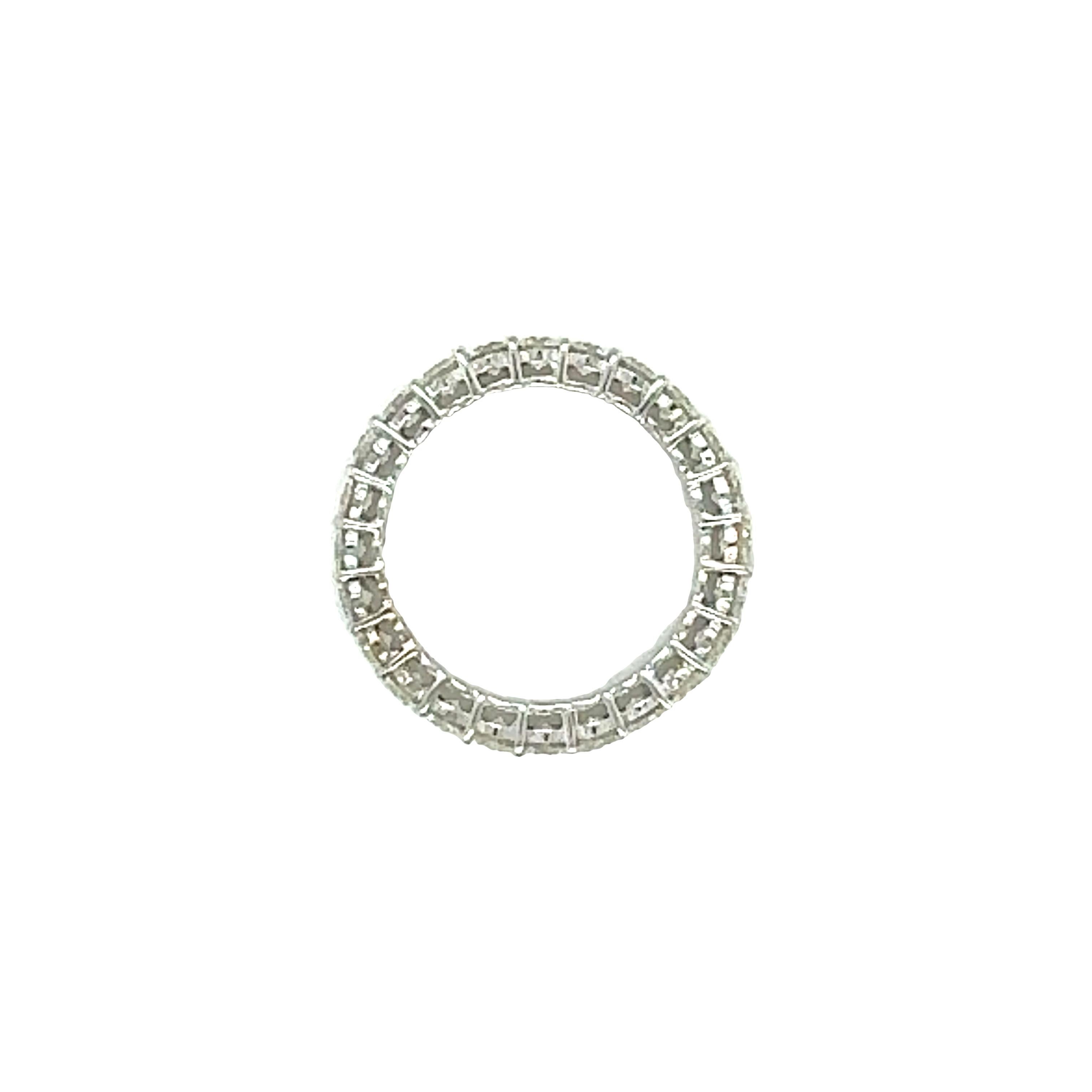 This stunning 14K white gold diamond eternity band is a timeless symbol of elegance and grace, featuring 24 prong-set round brilliant-cut diamonds totaling approximately 1.68 carats. With H-I color and VS-2 clarity, each diamond exudes exceptional