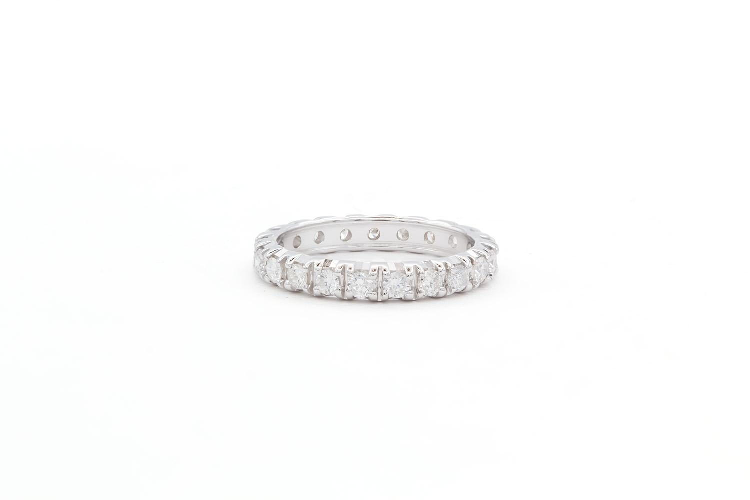We are pleased to offer this 14k White Gold & Diamond Eternity Wedding Band. This beautiful wedding band features an eternity style band with an estimated 0.80ctw G-H/VS-SI round brilliant cut diamonds all set in 14k white gold. The ring is size