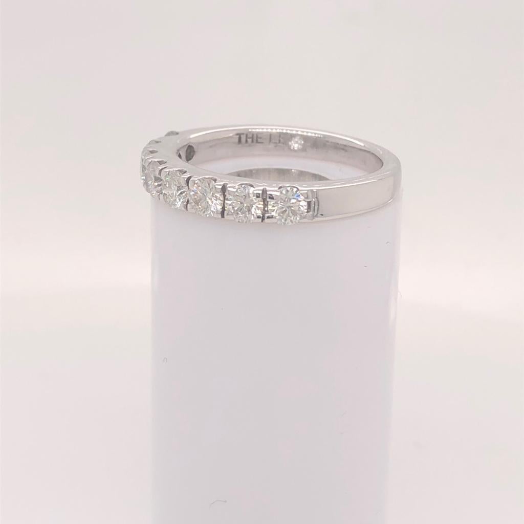 This Gorgeous Half Way Diamond with 14K White Gold Ring with Fishtail Setting luxurious ring. It has 8 Natural diamonds. It is graded at the top color, facing up a crisp white and extremely eye-clean. This beauty is handcrafted in a Fishtail setting