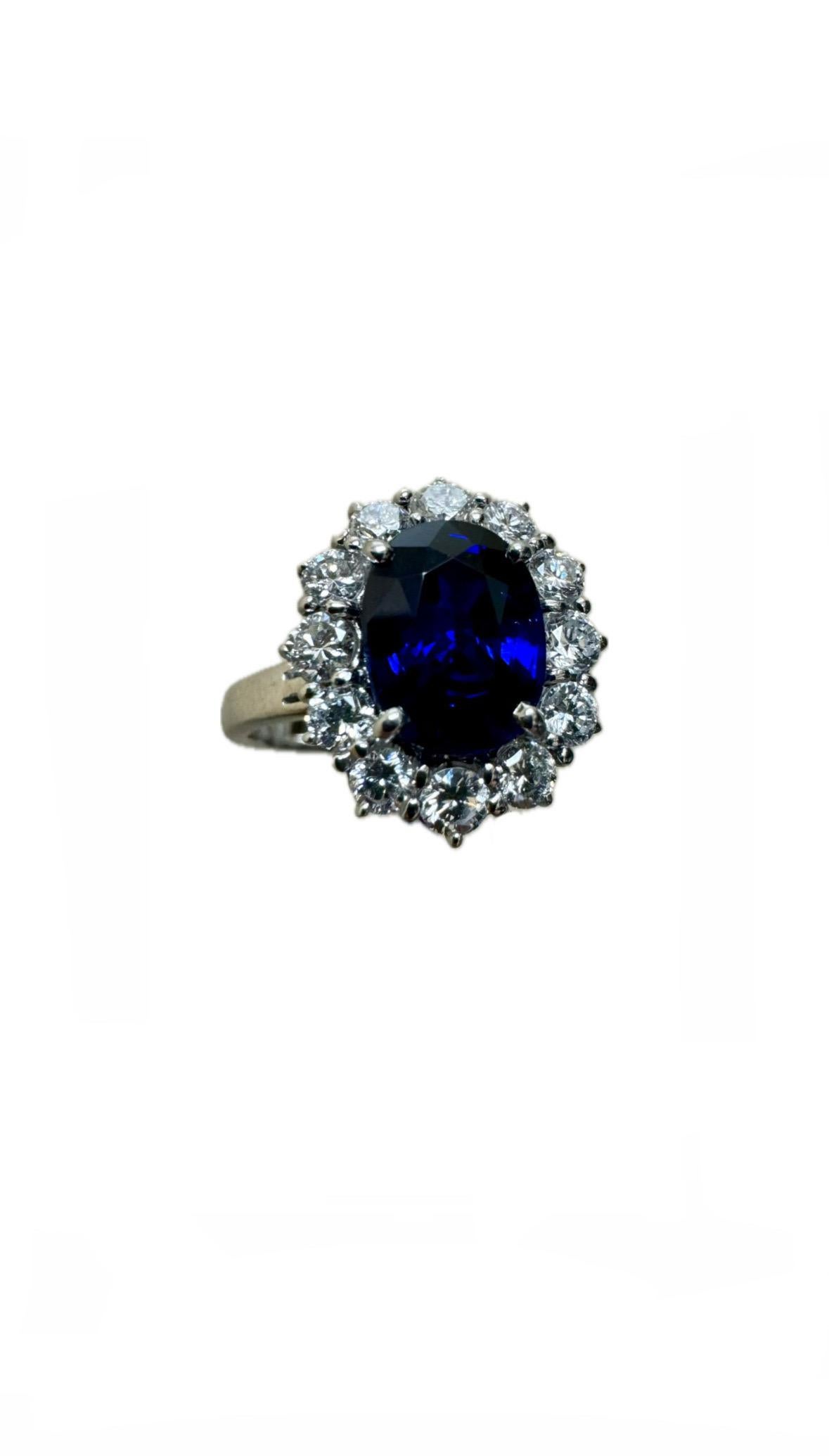DeKara Designs Collection

Metal- 14K White Gold, .583.

Stones- 1 Oval Blue Sapphire 2.25 Carats, 12 Round Diamonds G-H Color VS2 Clarity 0.76 Carats.

GIA Certificate Number 110176690705

Size- 6 1/2. FREE SIZING!!!!

Handmade 14K White Gold Halo