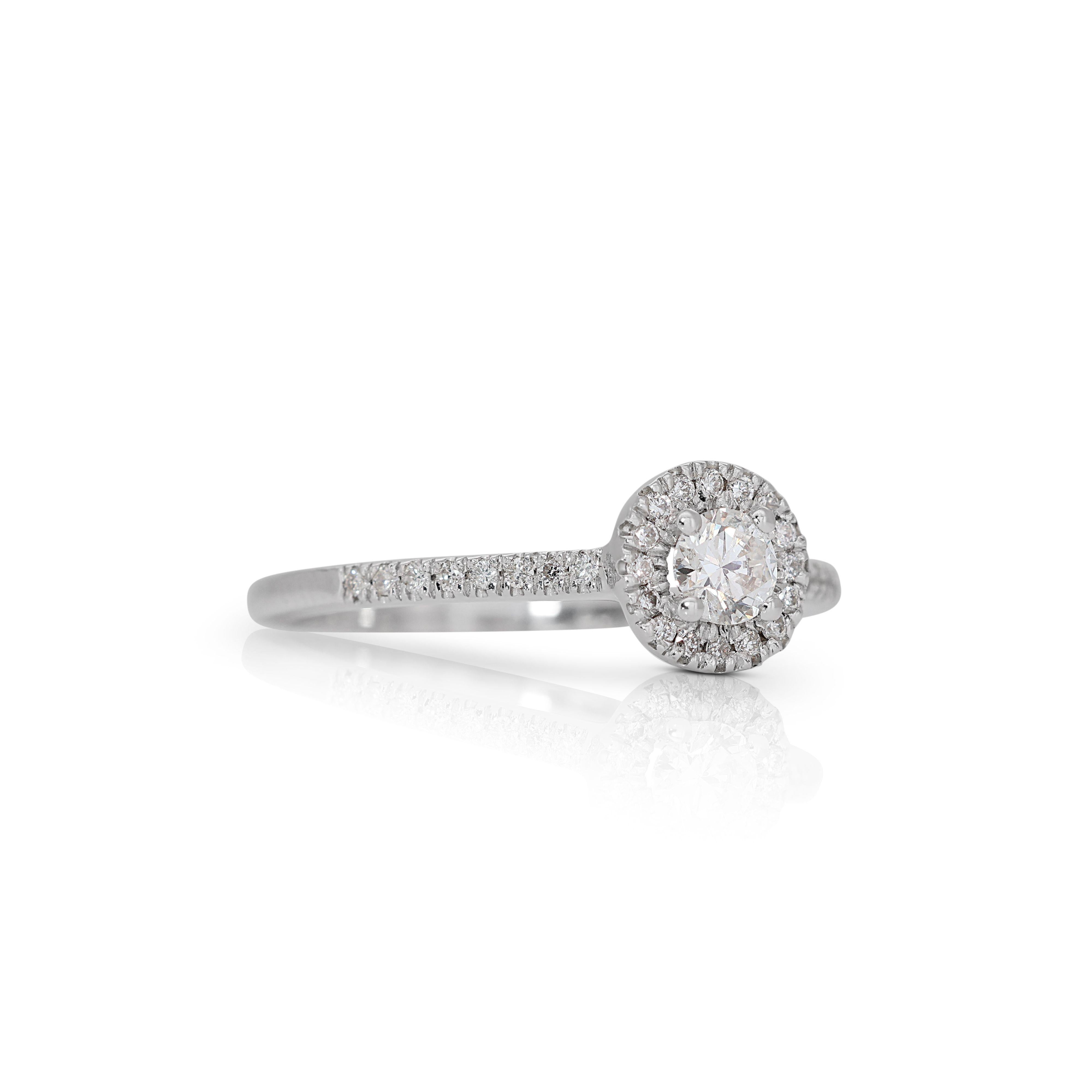 This ring is an ideal choice for those who appreciate the perfect union of classic and modern aesthetics. Whether worn as an engagement ring or as a statement piece for special occasions, the 14K White Gold Diamond Halo Pave Ring is a symbol of