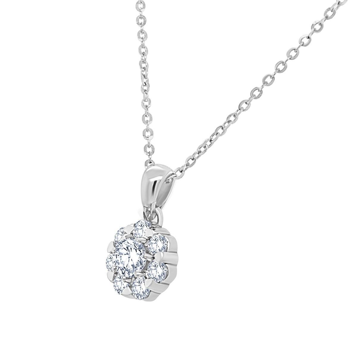 This sparkling halo diamond pendant features seven round brilliant diamonds surrounding a round brilliant center diamond.  This 0.97 carat total weight pendant is made in 14k white gold and is  all glitter!.

Product details: 

Center Gemstone Type: