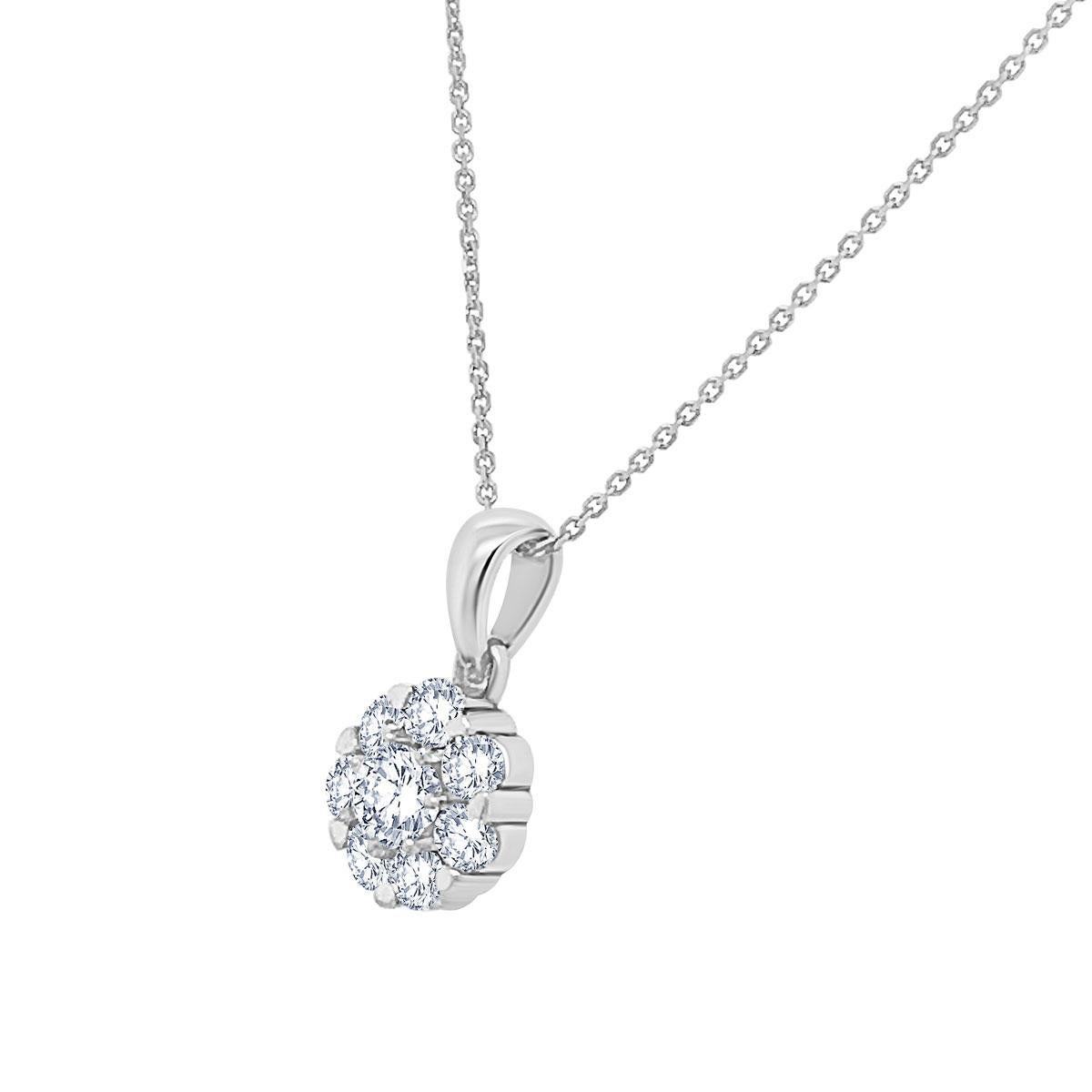 This sparkling halo diamond pendant features seven round brilliant diamonds surrounding a round brilliant center diamond.  This 0.76 carat total weight pendant is made in 14k white gold and is  all glitter!.

Product details: 

Center Gemstone Type: