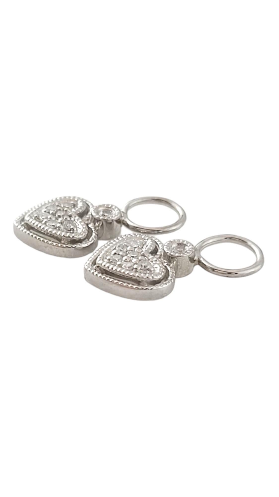 Vintage 14K White Gold Diamond Heart Earring Charms for Hoops -

Create a stylish combination with your hoop earrings and these adorable 14K white gold earring charms with 14 sparkling single cut diamonds! 

Approximate total diamond weight: .08