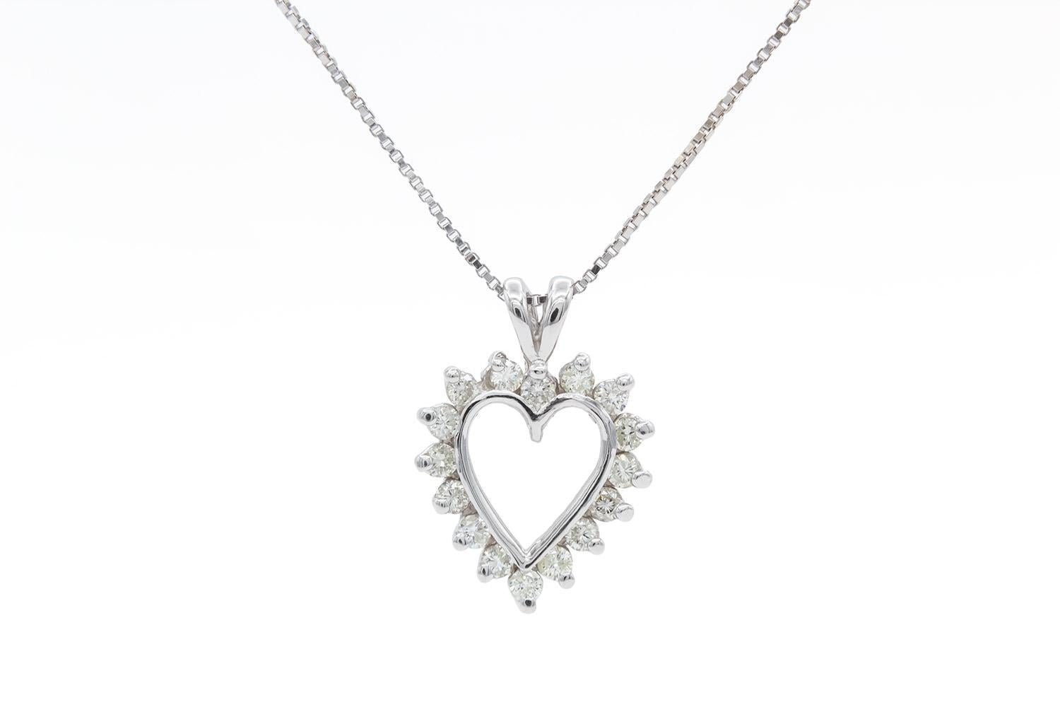 We are pleased to offer this 14k White Gold & Diamond Heart Silhouette Pendant Necklace. A timeless pendant crafted from dazzling round diamonds, celebrating the exquisite silhouette of your love. This is stunning 14k white gold pendant is set with