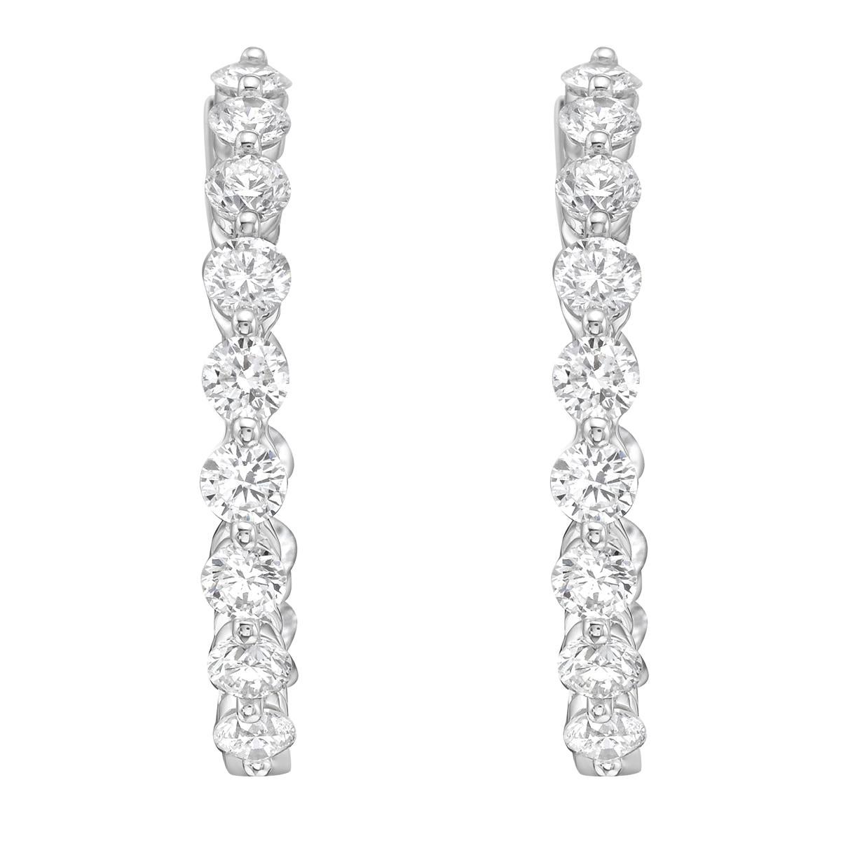 These 14K white gold diamond hoop earrings are bold, bright, and made to stand out. They are crafted from polished white gold, giving them a clean and shiny finish that looks beautiful from every angle. With a classic hoop shape and elegant design,