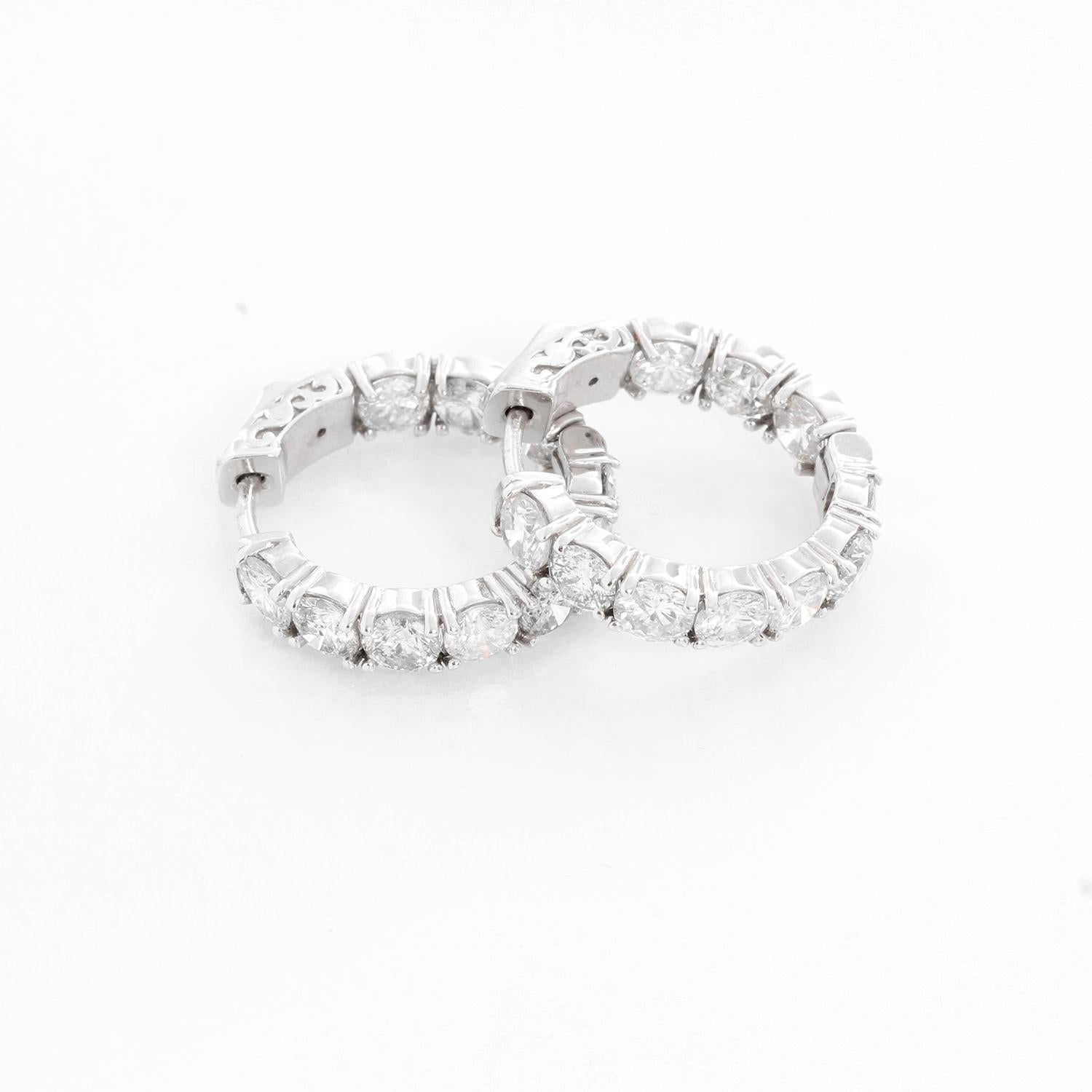 14K White Gold Diamond Hoops 5.22 cts - The earrings feature 5.22 carats of SI3-I1 clarity and G-H-I color diamonds. It is .75 apx.-inch in diameter with a total weight of 6.83  grams. Total 20 stones.