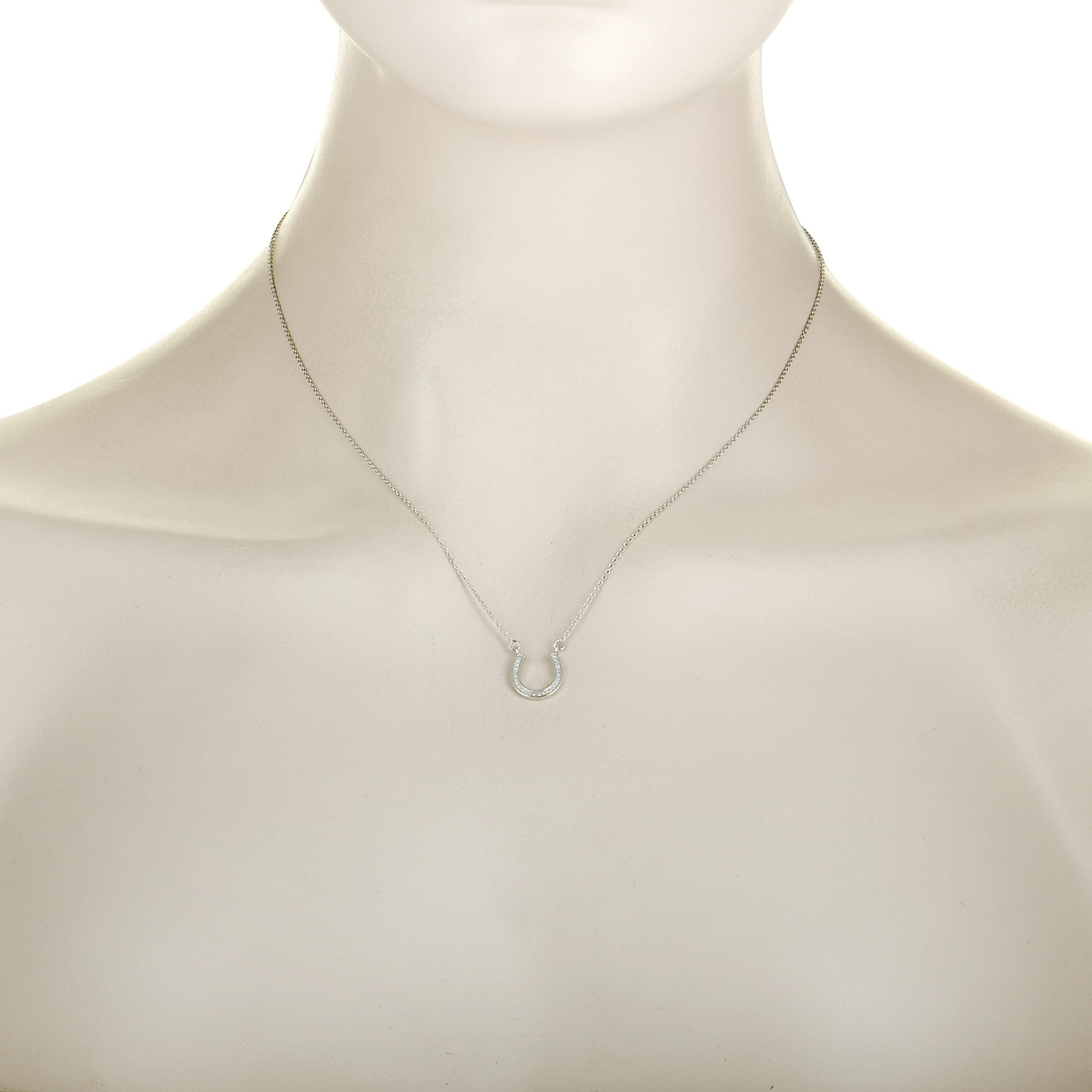 This necklace is crafted from 14K white gold and weighs 2.4 grams, boasting chain length of 17.00” while the pendant measures 0.55” by 0.45”. The necklace is set with diamonds that weigh 0.10 carats in total.
 
 Offered in brand new condition, this