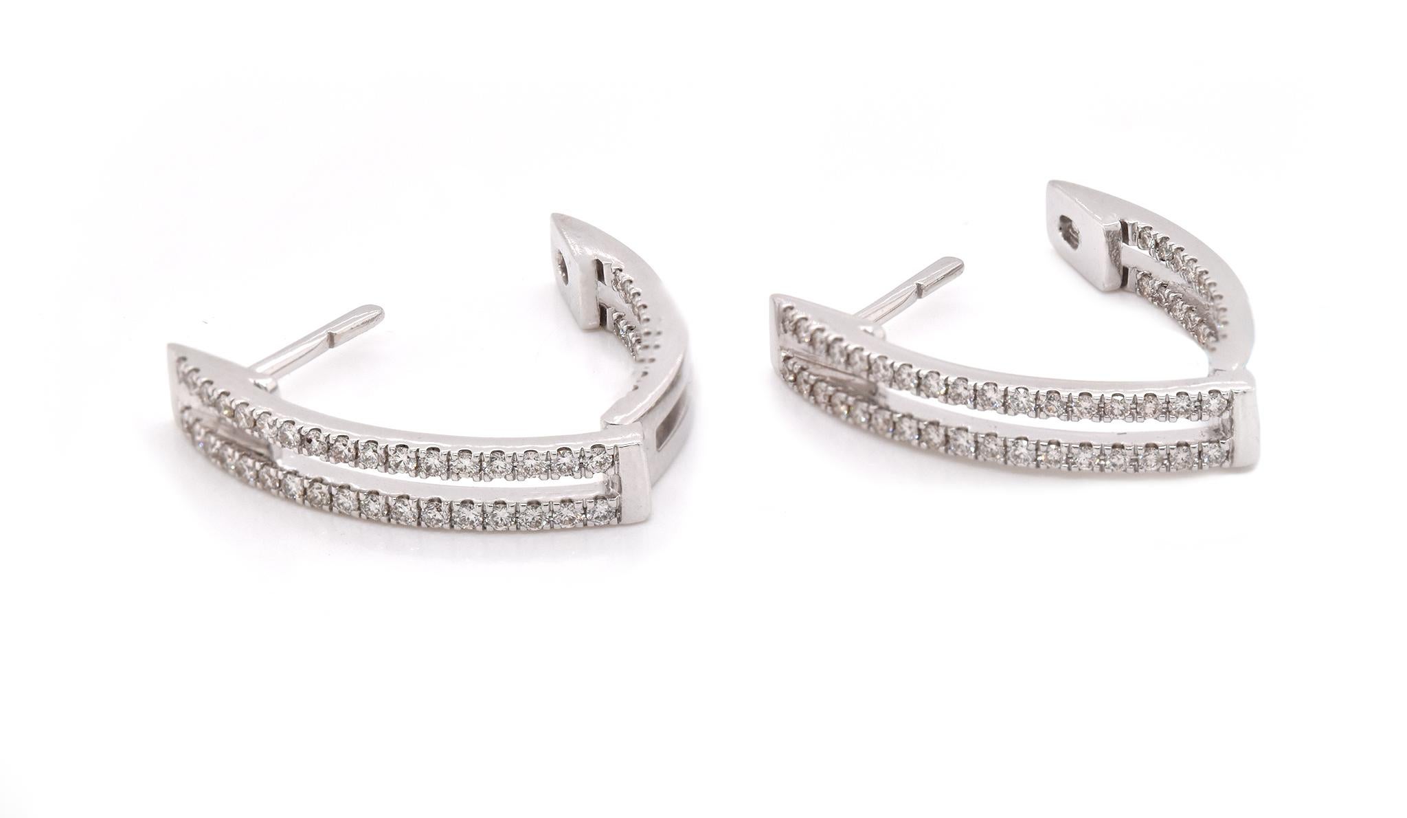Material: 14k white gold
Diamonds: 108 round brilliant cuts = 0.65cttw
Color: G
Clarity: VS
Dimensions: earrings measure 23.15mm x 13mm
Fastenings: snap closure
Weight: 5.38 grams
