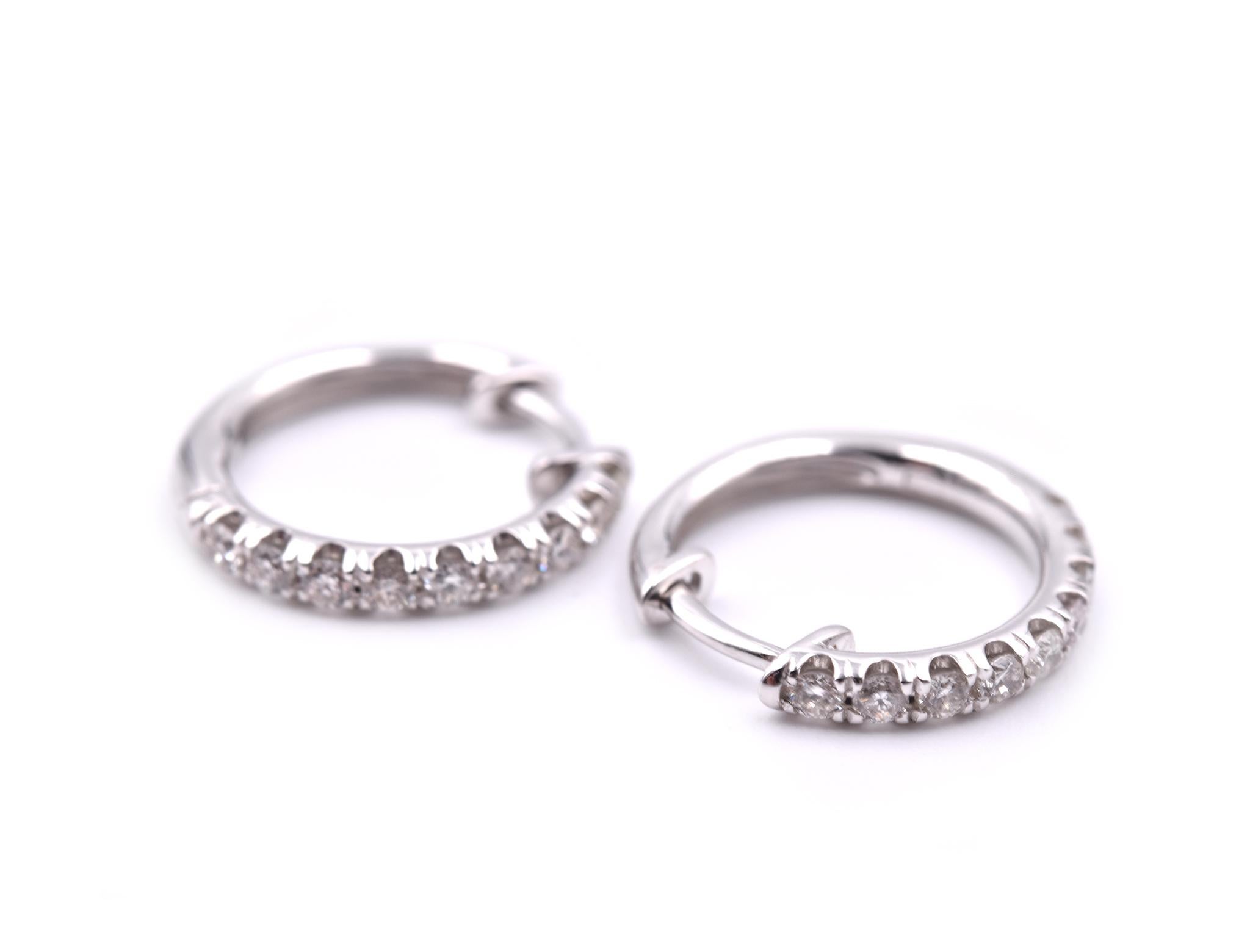 Designer: custom design
Material: 14k white gold
Diamonds: 18 round brilliant cut = 0.46cttw
Color: G
Clarity: VS
Dimensions: earrings are approximately 15.96mm in diameter and 2.23mm wide
Fastenings: huggie
Weight: 2.70 grams
