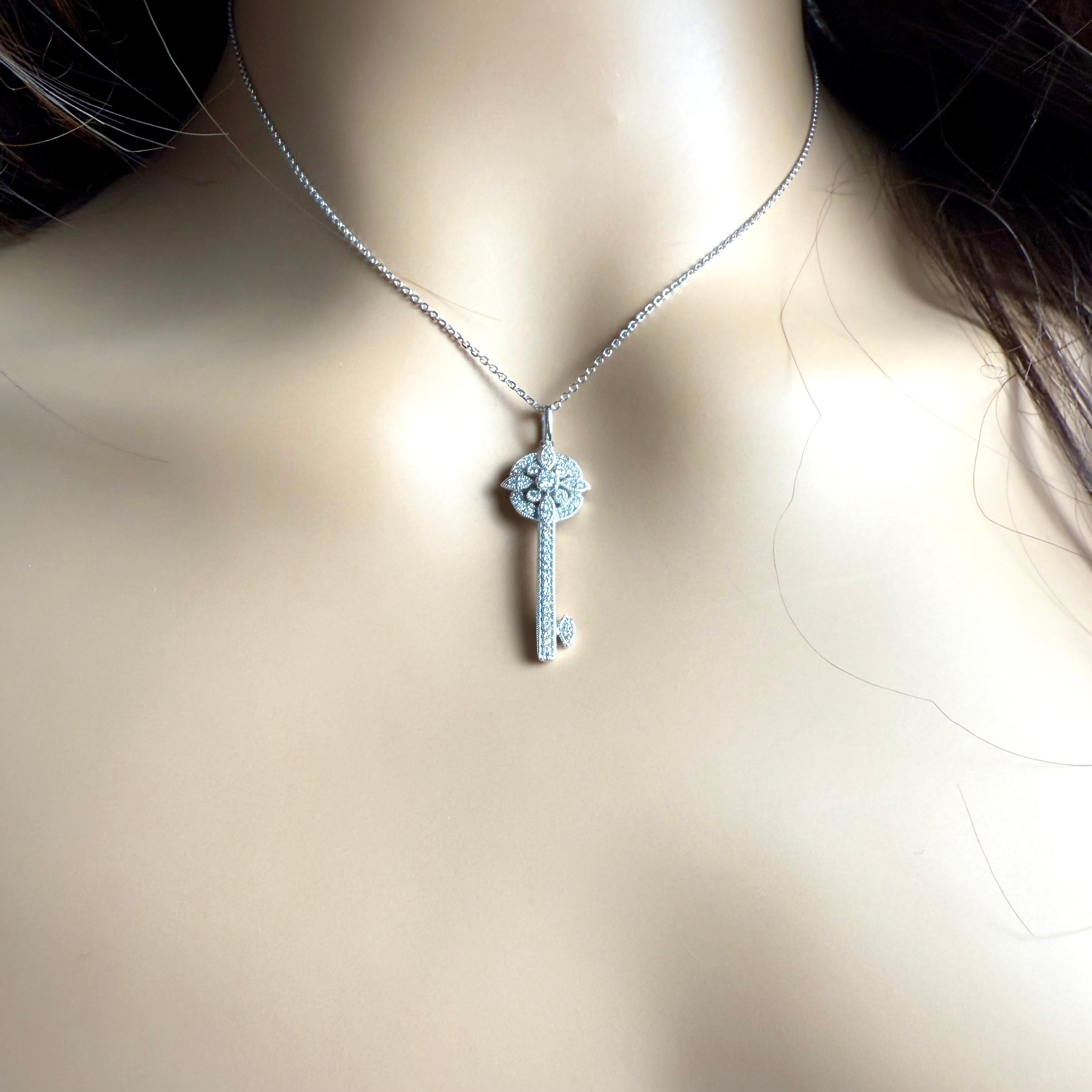 Moderno 14K White Gold Diamond Key Pendant Necklace 1.5 Inch Long in vendita
