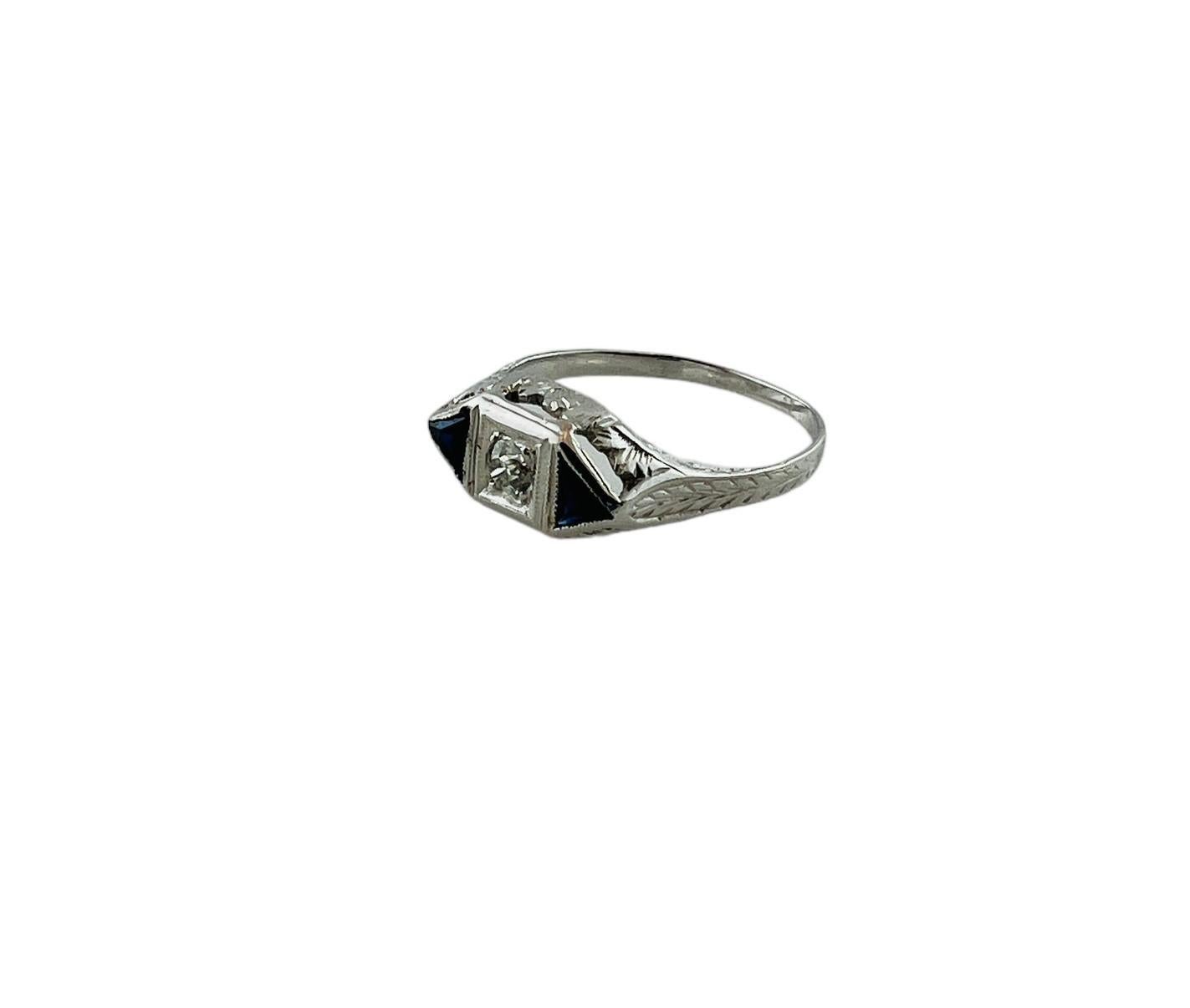 14K White Gold Diamond Lab Created Sapphire Filigree Ring

This beautiful ring is set in 14K white filigree gold. 

The center old mine diamond is approx. .10cts and of I1 clarity and I color

Diamond is surrounded by two triangle lab created