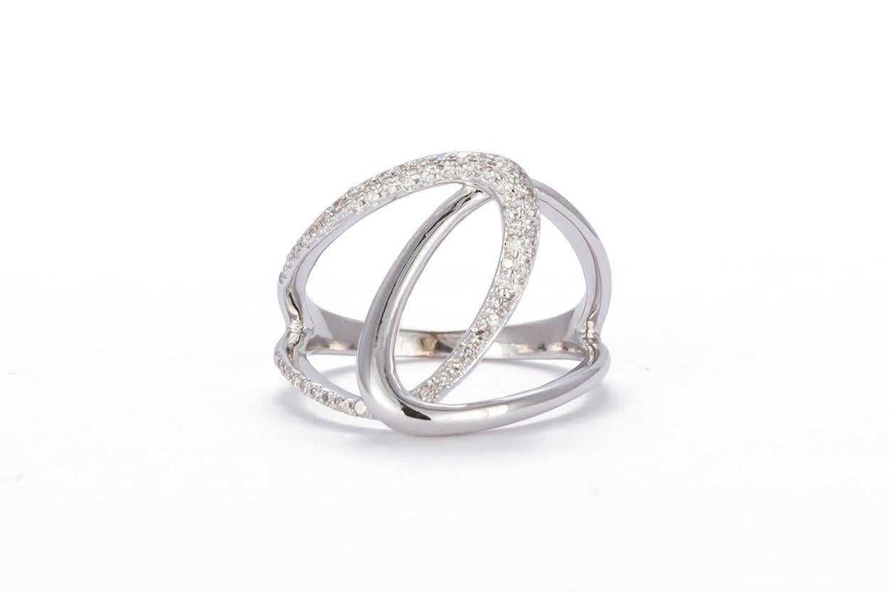 We are pleased to offer this 14k White Gold & Diamond Ladies Fashion Ring. This beautiful and fun fashion ring features a swooping design with and estimated 0.30ctw H-I/SI1-SI2 Round Brilliant cut diamonds all set in 14k White Gold. The ring tappers