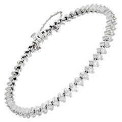 Bracciale con linea di diamanti in oro bianco 14k con circa 5 carati di taglio rotondo