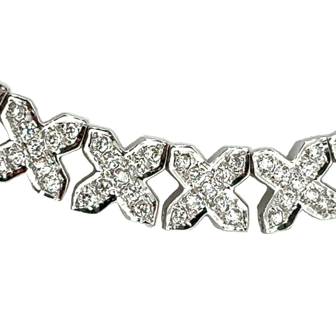 This luxurious 14K white gold “X” link necklace is adorned with 360 pavé-set round brilliant-cut diamonds, totaling an impressive 5.40 carats. With H-I color and SI-1 to SI-2 clarity, the diamonds create a continuous, dazzling display of sparkle