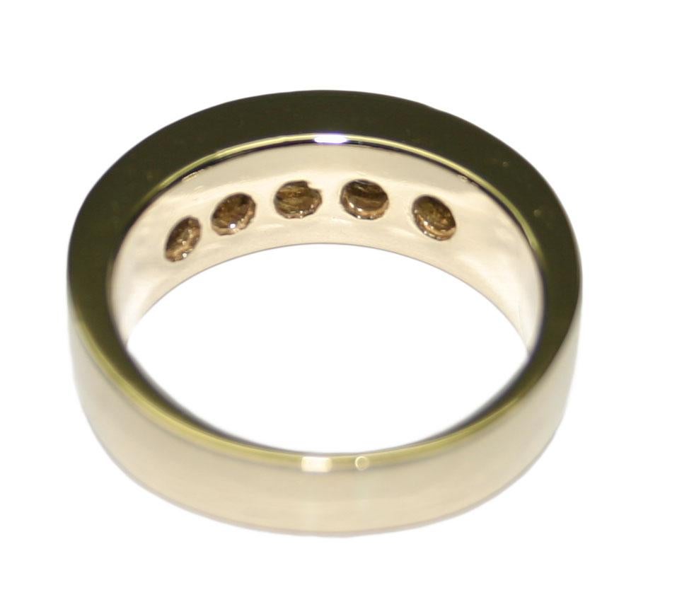 This Is A Handsome Men’s 14k Yellow Gold And Diamond Band.
The Band Weighs a Total of 13.4 Grams.
It Contains Five Round Brilliant Diamonds, With A Total Diamond Carat Weight Of 1.50, SI Clarity, And I Color.
These Diamonds Measure Approximately
