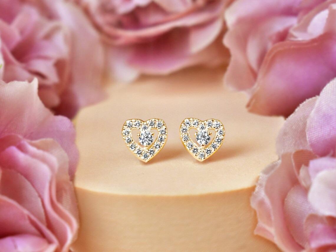 Diamond Mini Heart Stud Earrings in 14k Rose Gold, Yellow Gold, White Gold.

These Dainty Stud Earrings are made of 14k solid gold featuring shiny brilliant round cut natural diamonds set by master setter in our studio. Simple but unique, elegant