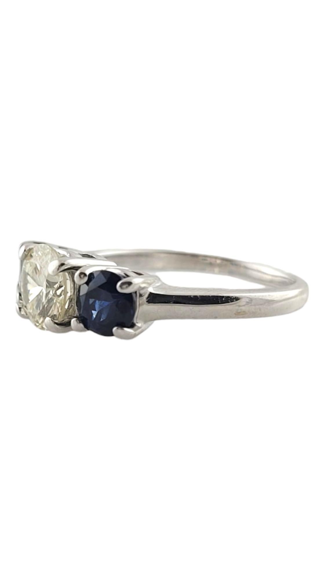 14K White Gold Diamond & Natural Blue Sapphire Trinity Style Engagement Ring Size 7.5

This stunning trinity style engagement ring is crafted from 14K white gold and features one round brilliant cut diamond surrounded by two round cut natural blue