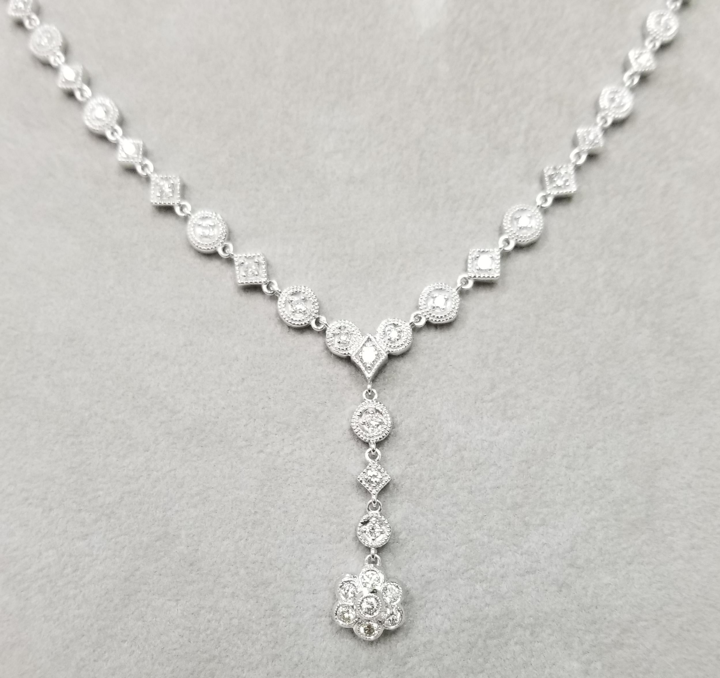 14k white gold diamond necklace, containing 
 Specifications:
    main stone: ROUND CUT DIAMONDS
    diamonds: 69 PIECES
    carat total weight: 2.51cts.    
    color: G
    clarity: VS2
    brand: custom
    metal:  14K GOLD
    type: TENNIS