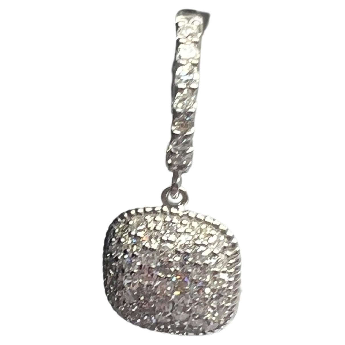 
Elevate your jewelry collection with these stunning 14k white gold diamond pave dangle drop huggy earrings. The round, natural diamonds are set in a pavé style and have a sparkling white color that perfectly complements the elegant design. The