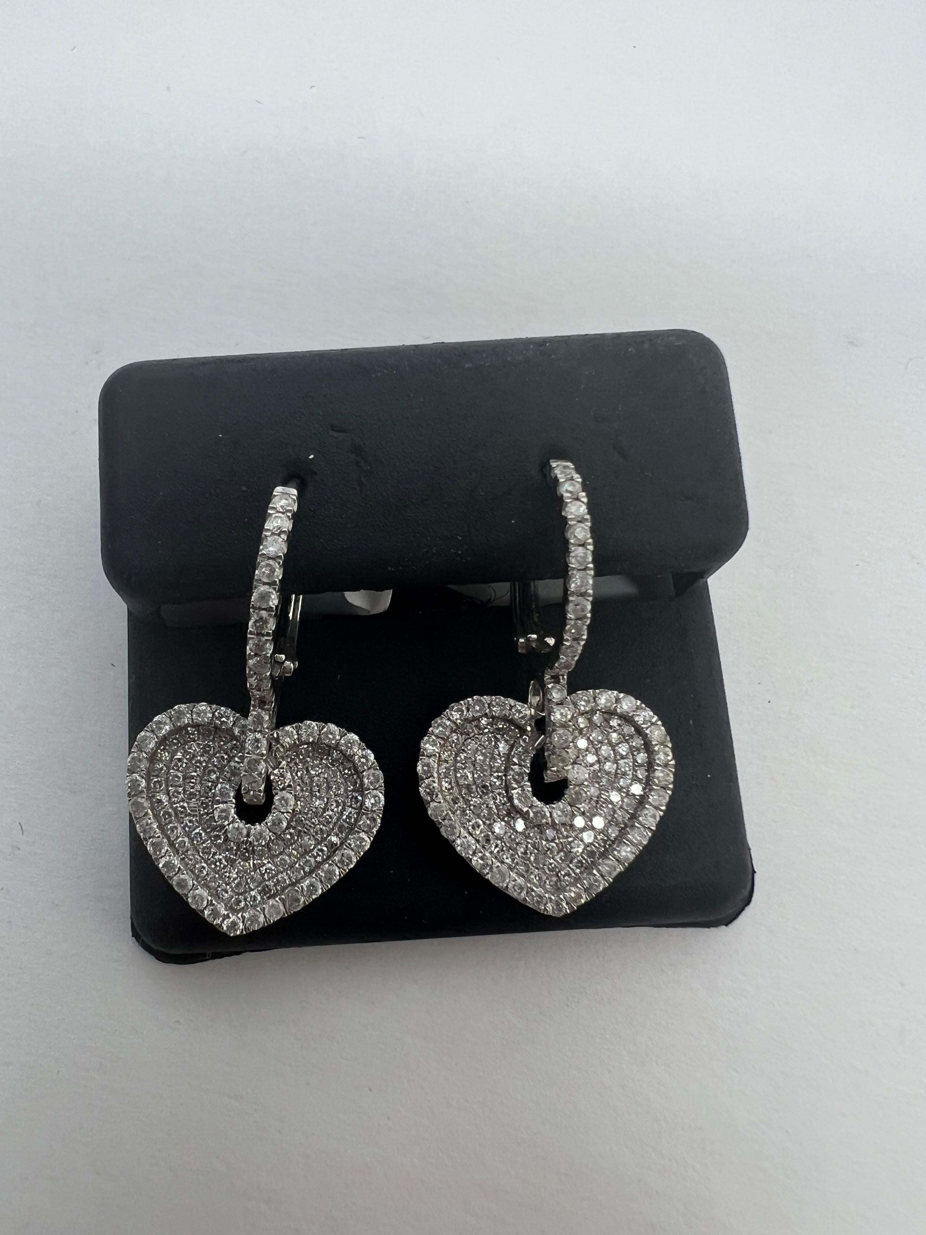14k White Gold Diamond Pave Heart Drop Dangle Huggy Earrings

Total Carat Weight : 1.07 carats

Natural round Brilliant cut Diamonds

Color : G

Clarity Vs2-Si1

cut:  Very good

free overnight shipping shop with confidence

Evita Diamonds