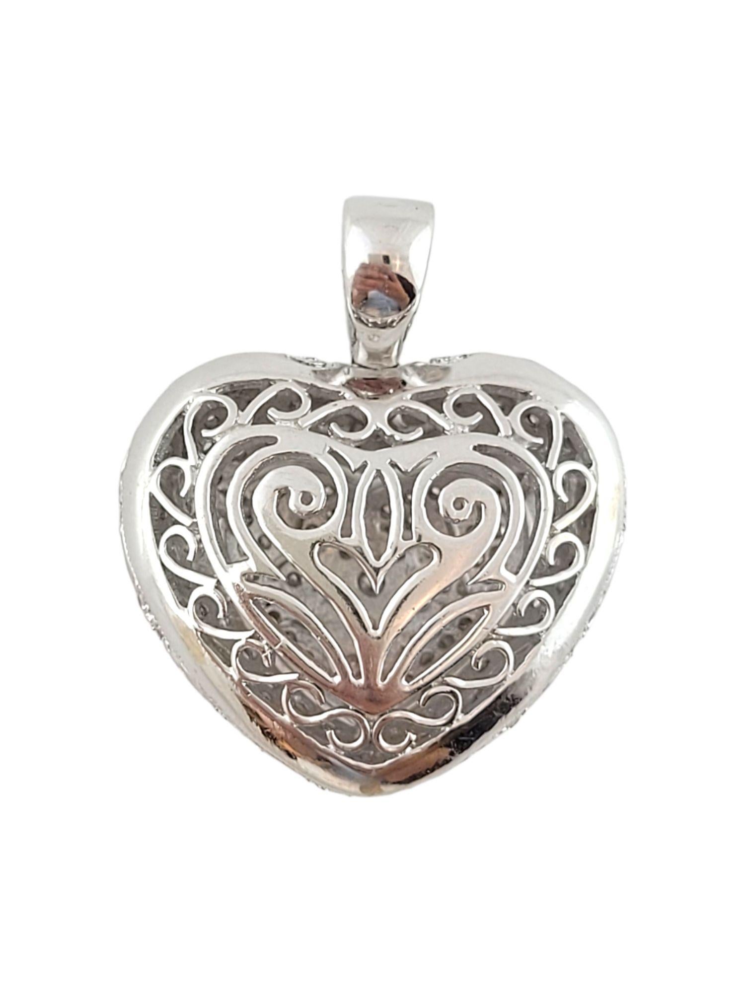 This gorgeous hollow heart pendant is crafted from 14K white gold and is decorated with 146 round brilliant cut diamonds for a beautiful, sparkling finish!

Approximate total diamond weight: 1.32 cttw

Diamond clarity: SI1-I1

Diamond color: