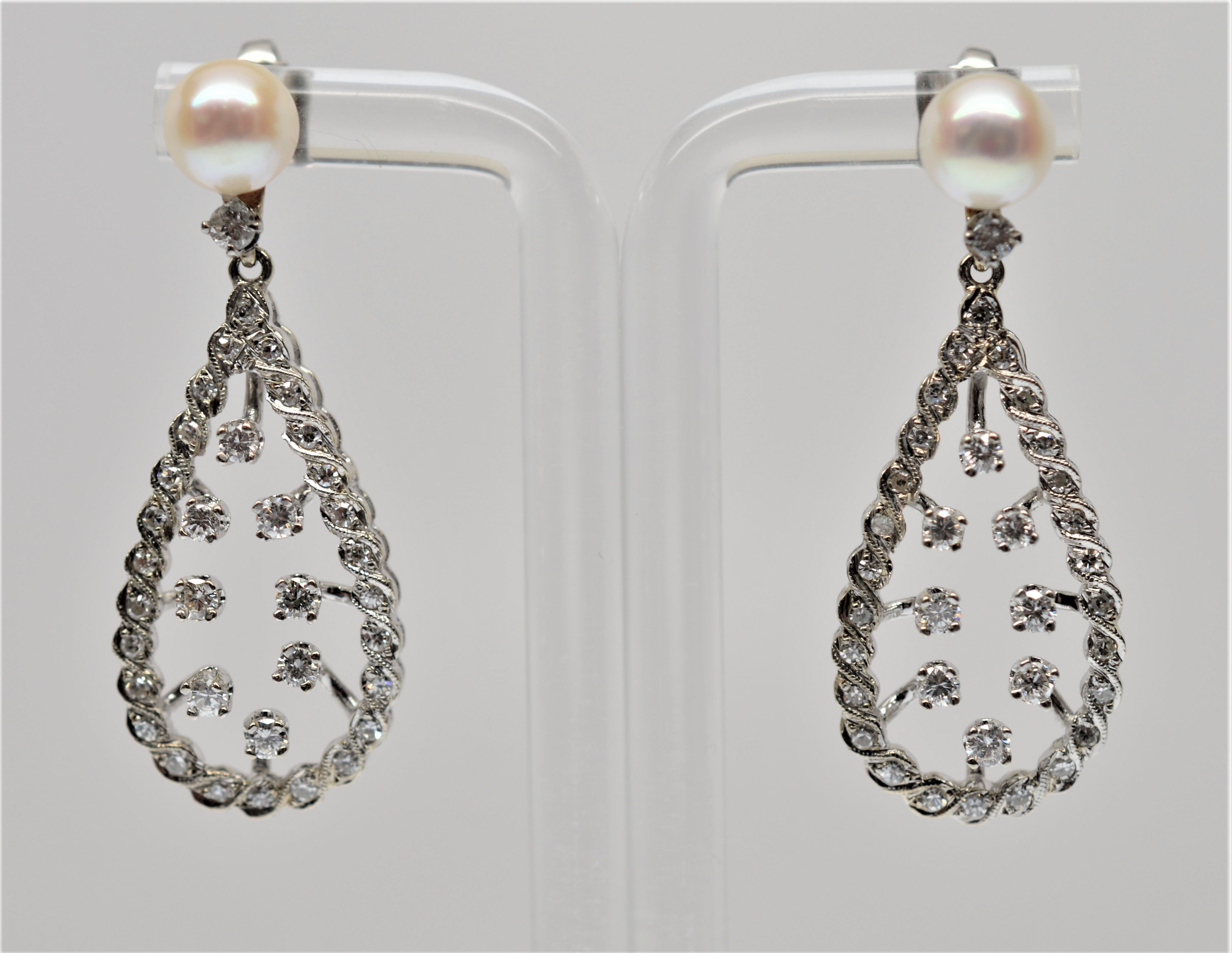 Genuine 7mm AAA Akoya Pearls start off these beautiful Diamond Drop Earrings. Each drop is covered with over thirty Diamonds intertwined in a 14K White Gold pear shape frame highlighting eight suspended Diamond center stones. The Earrings dangle