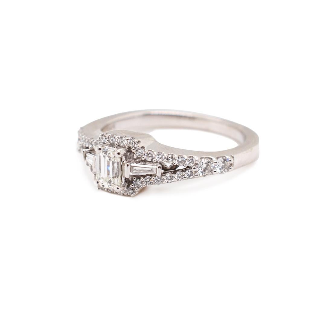One lady's custom made polished 14K white gold, diamond engagement ring with a soft-square shank. The ring is a size 7. The ring weighs a total of 4.40 grams. Engraved with 