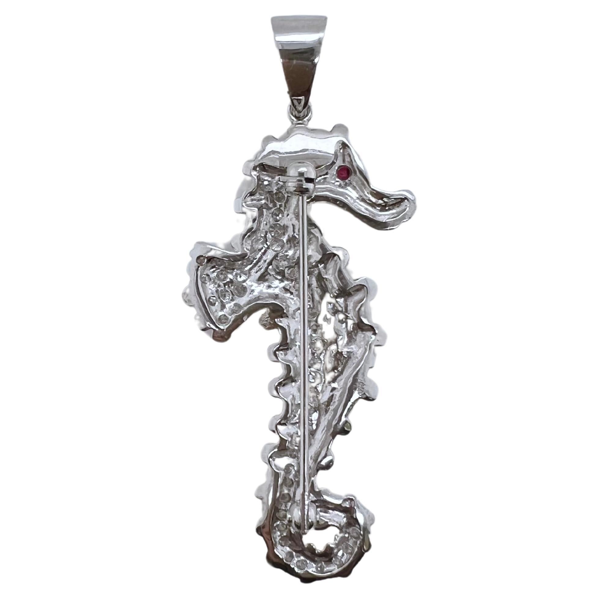 This whimsical seahorse pendant is for all the ocean and sea creature enthusiasts.  This unique seahorse is set with brilliant round diamonds with ruby eye and exhibits realistic features just like real list and can be turn into either a brooch or