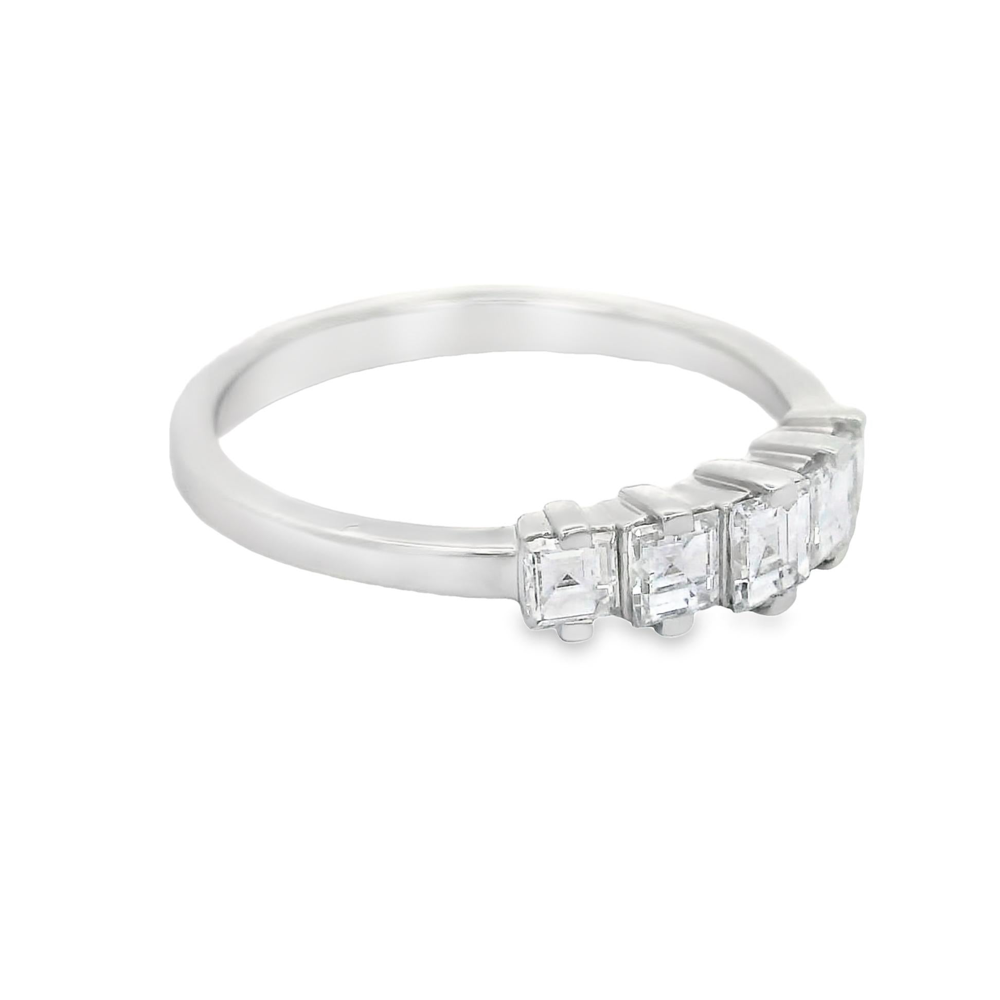 A five piece square cut diamond ring, featuring 5 stones weighing a total of 0.75 carats. The band is sleek and simple, allowing the diamonds to take center stage. Can be worn daily for everyday use. Made in 14k White gold and ready to worn!

The