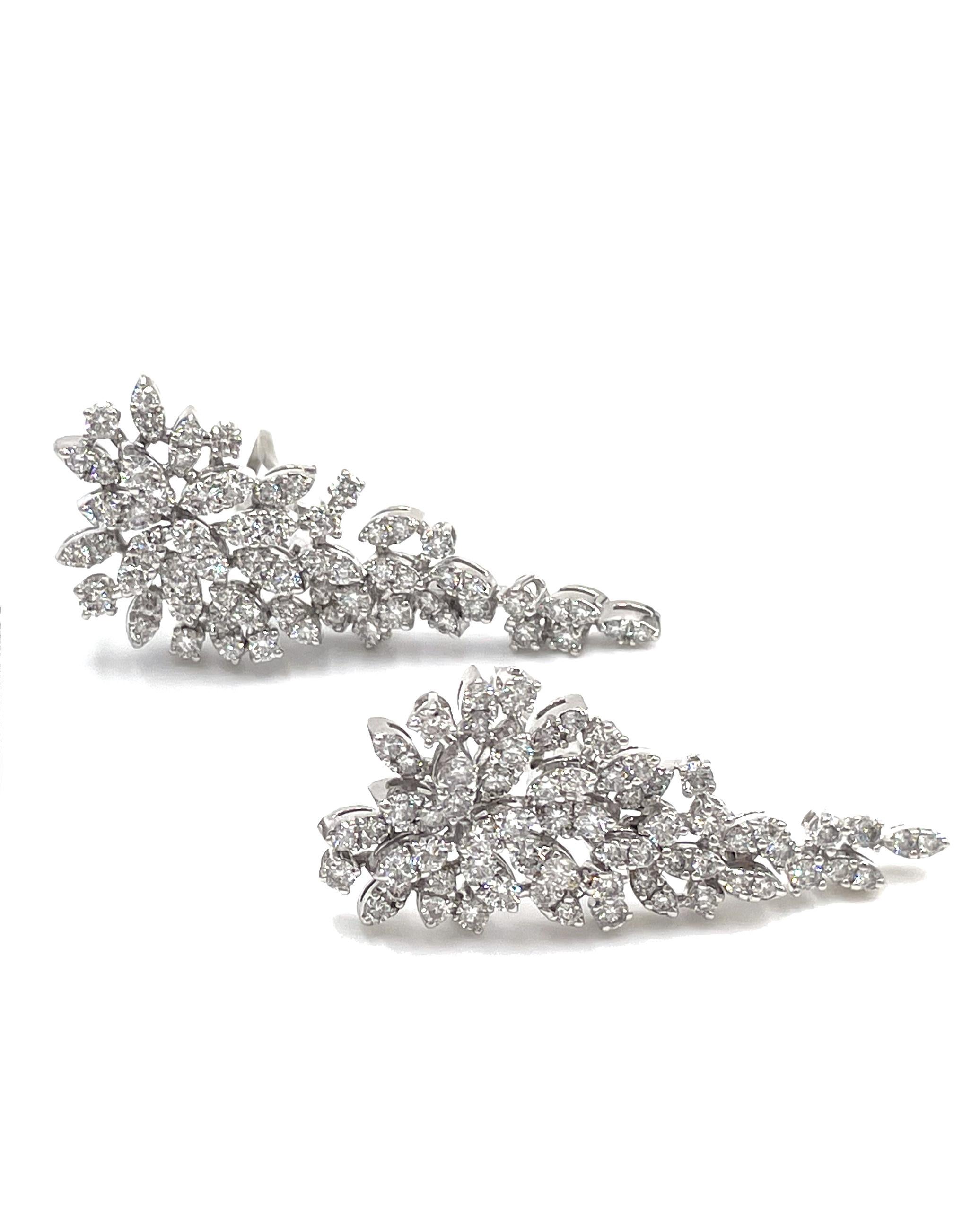 14K white gold fashion statement earrings with Omega backings.  The earrings are furnished with 116 round brilliant-cut diamonds weighing 3.81 carats total. 

* Diamonds are H color, SI clarity.