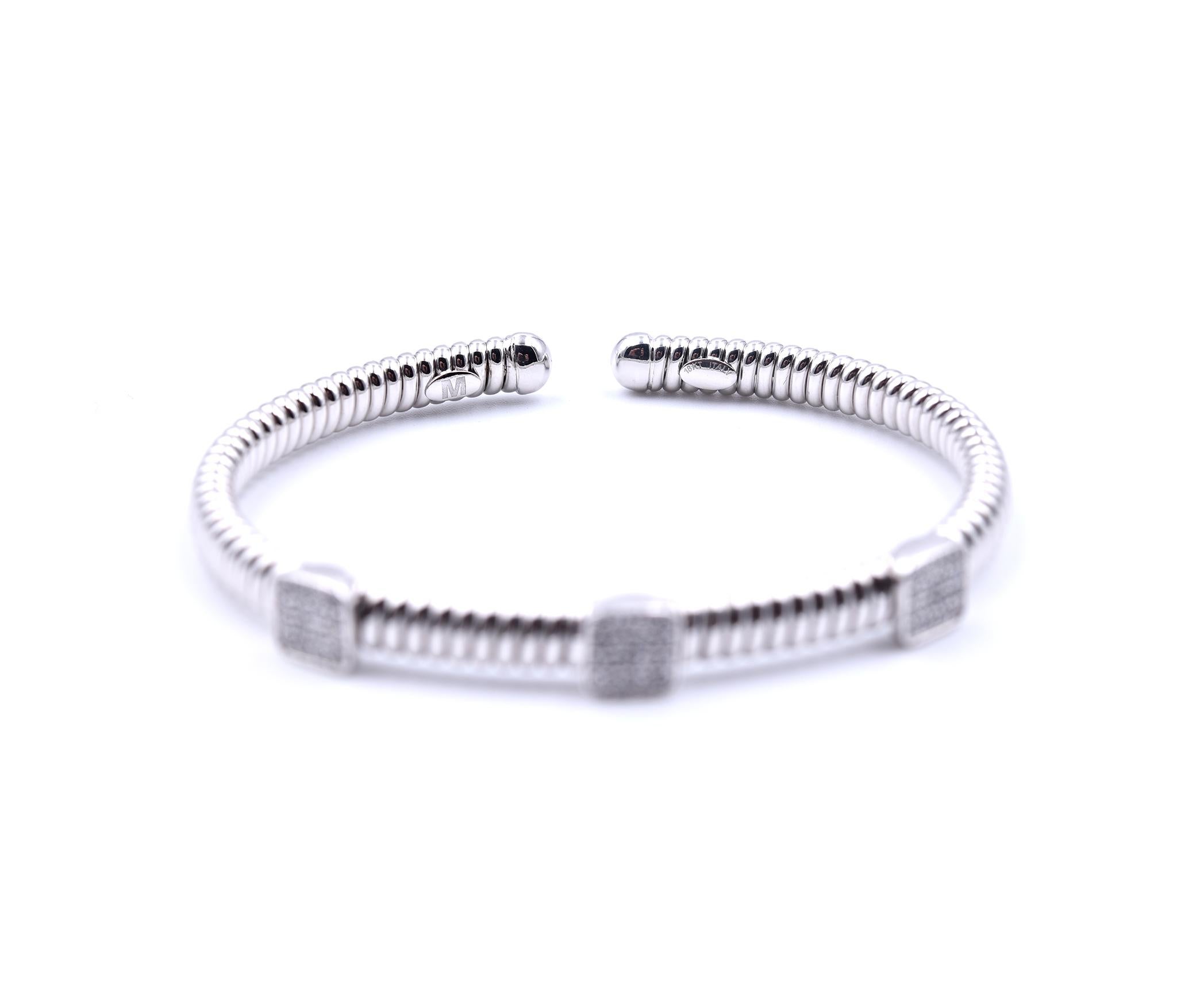 Designer: custom designed
Material: 14k white gold
Diamonds: 48 round brilliant cut= .50cttw
Color: G
Clarity: VS
Dimensions: bracelet will fit a 6 ½-inch wrist and it is 5.33mm wide
Weight: 13.20 grams