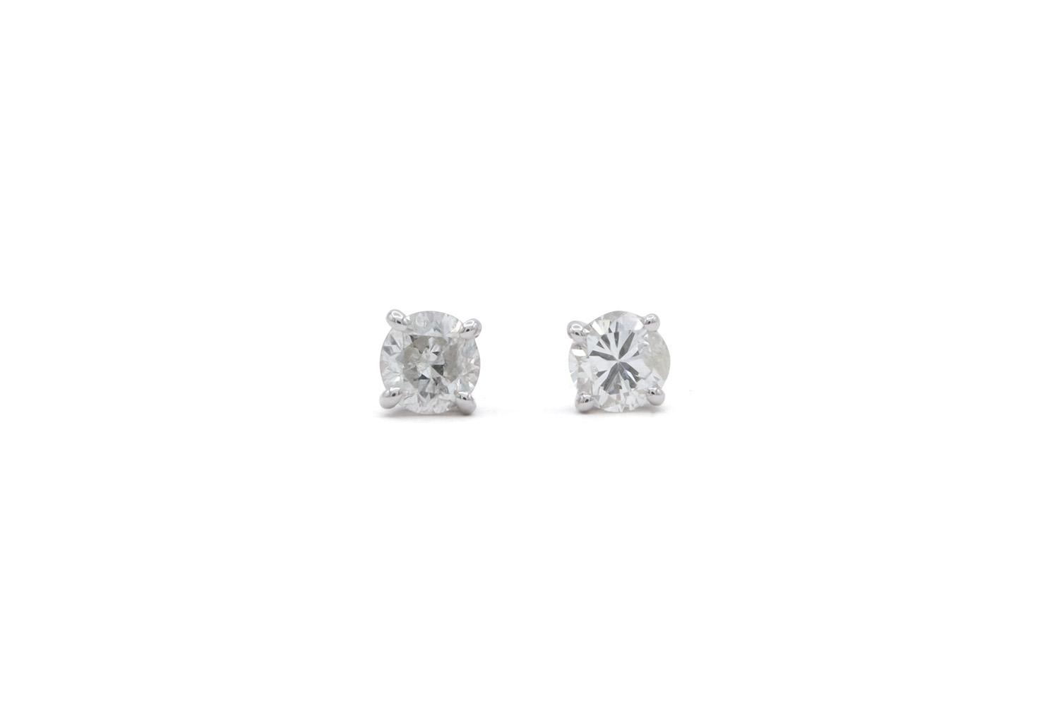 We are pleased to present these 14K White Gold & Diamond Stud Earrings. These beautiful earrings feature 0.71ctw H-I/SI2-I1 Round Brilliant Cut Diamonds set in 14k White Gold studs with slide back setting. The diamonds have lots of sparkle! They are