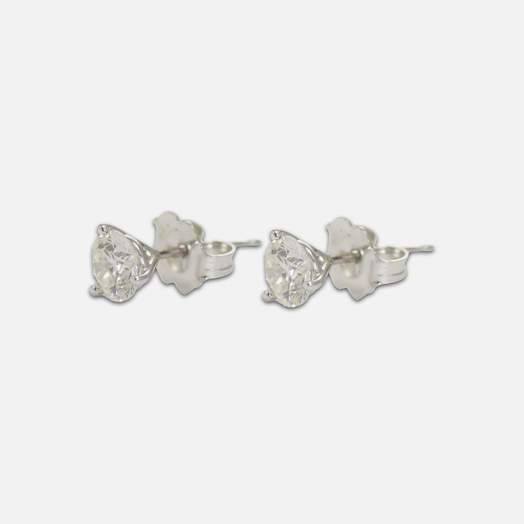 Diamond stud earrings in 14k white gold.
The diamonds are round brilliant cuts, .85 total carat weight.
One is h to i color, i1 clarity, and the other one is i to j color, i1 clarity.
Both diamonds are very brilliant and have very good
