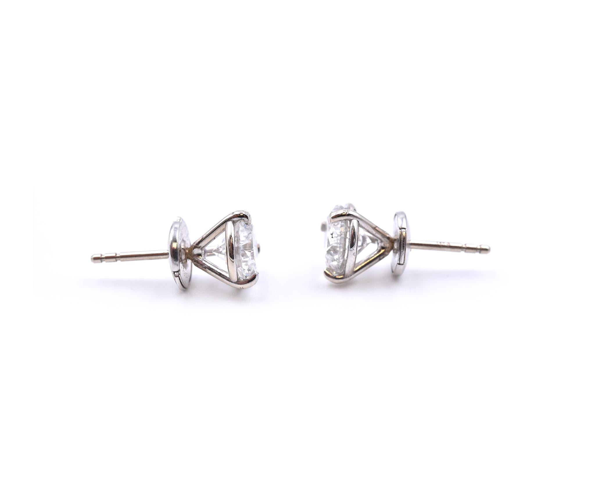 Material: 14k white gold
Diamond: 1 round brilliant cut = 1.04ct
Color: H
Clarity: SI2
Diamond: 1 round brilliant cut = 1.00ct
Color: H
Clarity: SI1
Dimensions: earrings measure approximately 7.6mm
Fastenings: post with la pousette backs
Weight: 