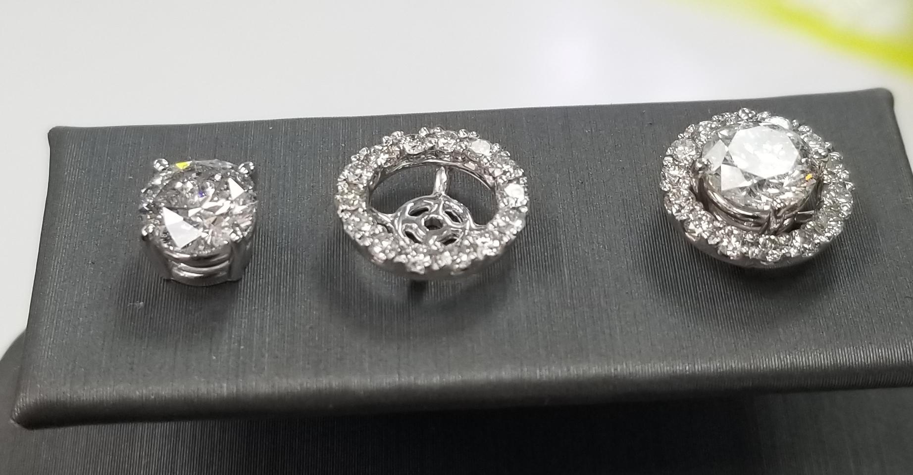 14k white gold diamond stud earrings with diamond halo-jackets, containing 2 brilliant cut diamonds; color 