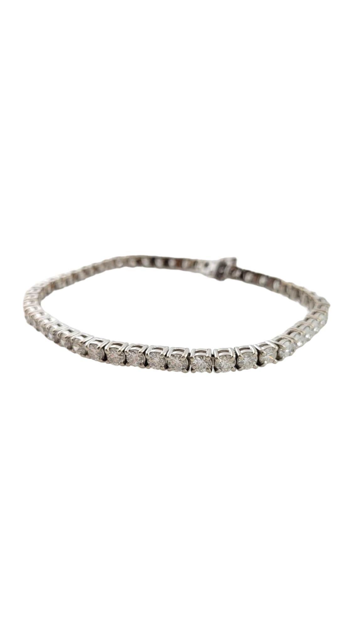 Vintage 14K White Gold Diamond Tennis Bracelet

This diamond tennis bracelet will sparkle across the room from your wrist!

The bracelet is set with 48 diamonds at approx. .15 pts each for a total of approx. 7.2 carats.

Diamonds are round