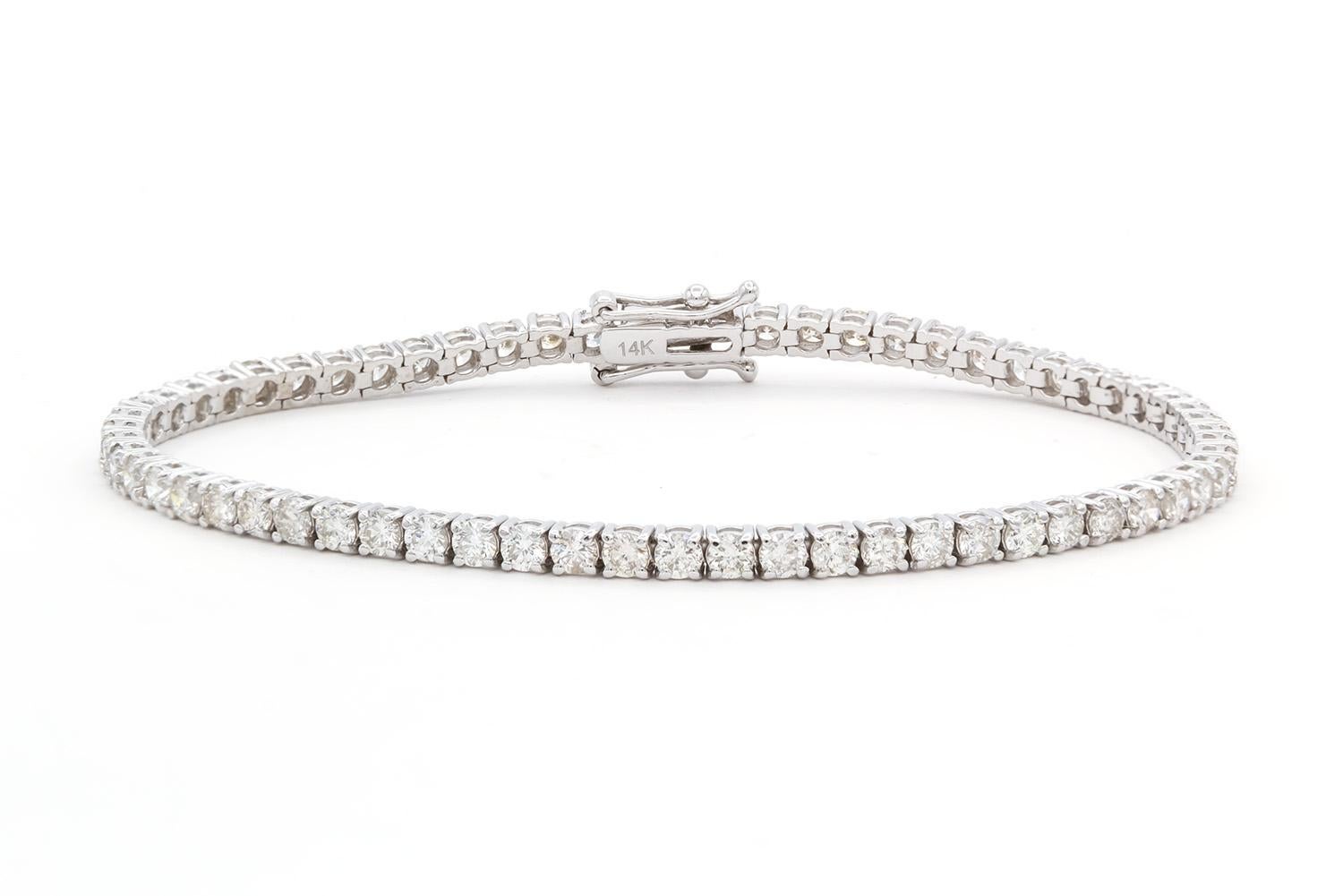 We are pleased to present this beautiful Brand New 14k White Gold & Diamond Tennis Bracelet. It features 4.47ctw G-H/VS2-SI1 Round Brilliant Cut Diamonds set in this 14k white gold tennis bracelet. The bracelet measures 7″ long and features a push