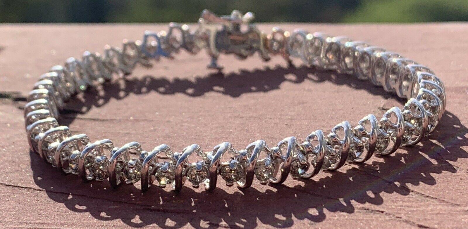 14K White Gold & Diamond Tennis Bracelet 4.75 ctw 15g


For sale is a 14k white gold and diamond tennis bracelet. 
The bracelet is comprised of approx. 4.75 ct of round brilliant cut diamonds L-M in color, I2-I3.
Perfect worn day or night.
Get this